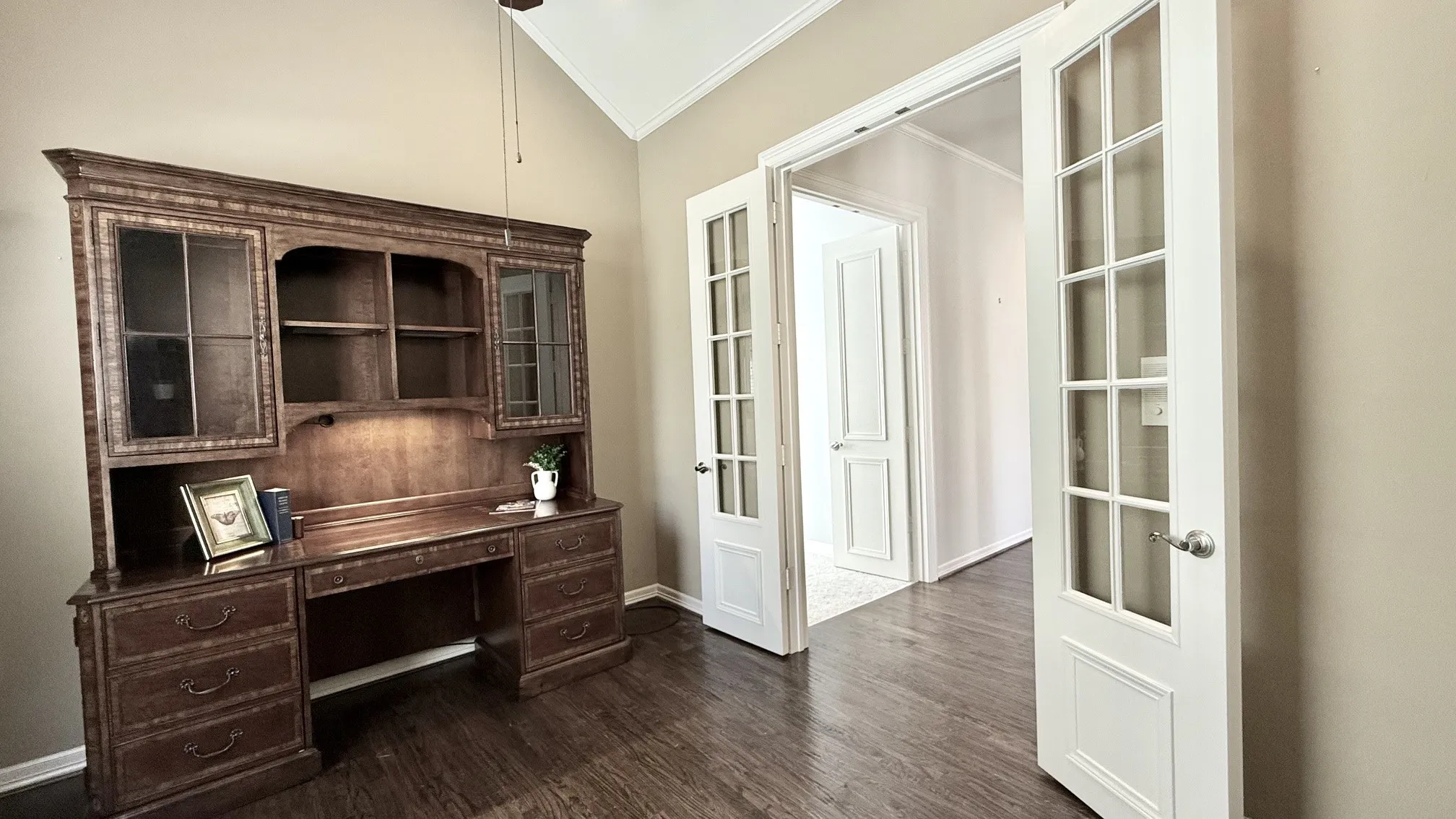 Located between the Primary and 2nd Bedrooms off a private hall way.
Double French doors with hardwood floors, could be a 4th bedroom.