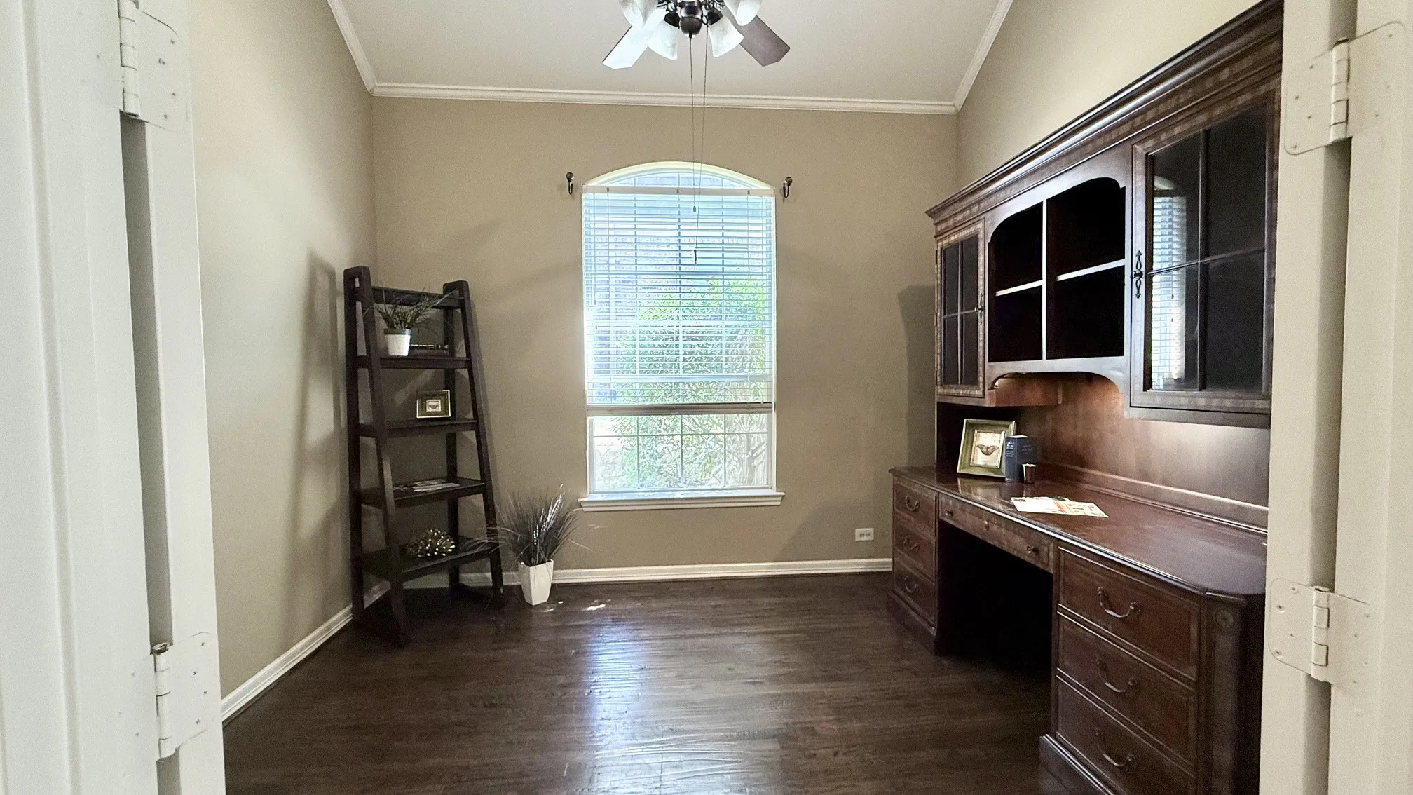 Located between the Primary and 2nd Bedrooms off a private hall way.
Double French doors , cathedral ceilings, hardwood floors. Could be a 4th bedroom.