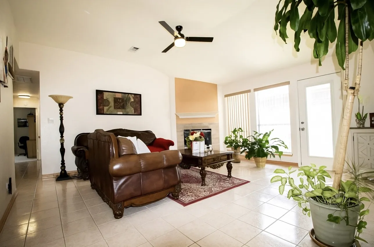 Living room featuring wood-burning fireplace
