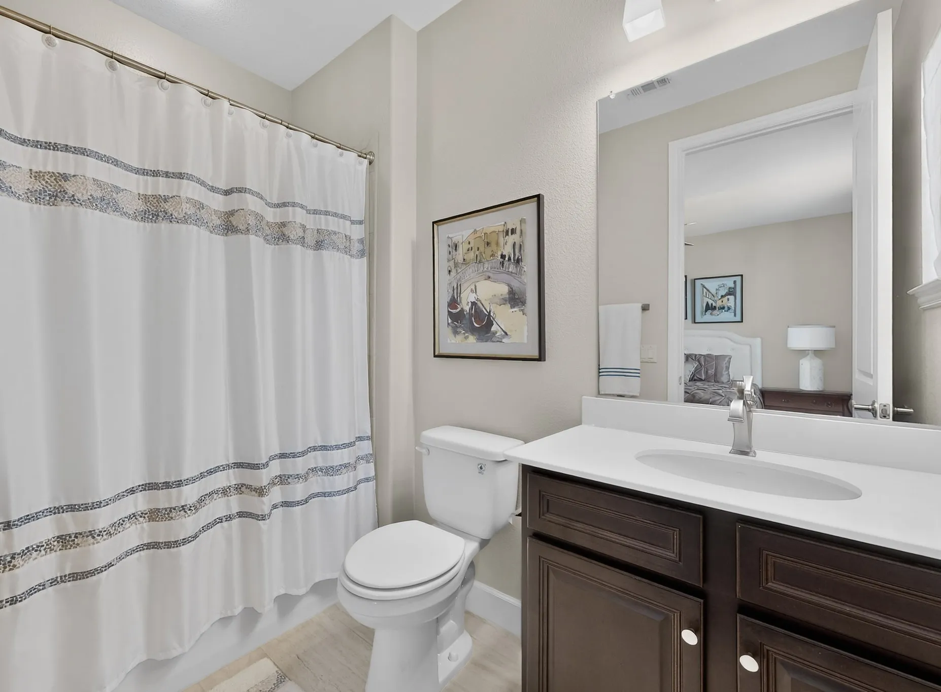 Guest bathroom with shower/tub combo.