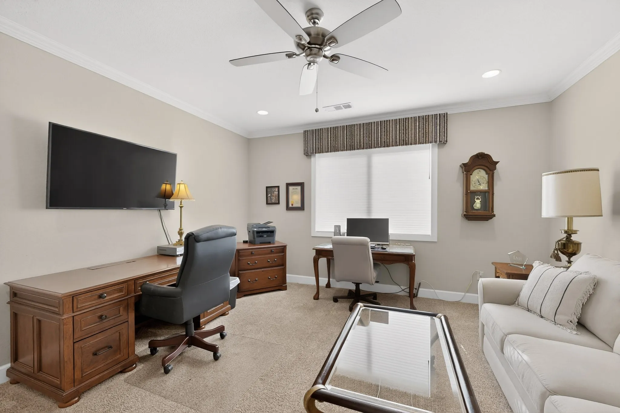 Office with custom blinds and window treatment.