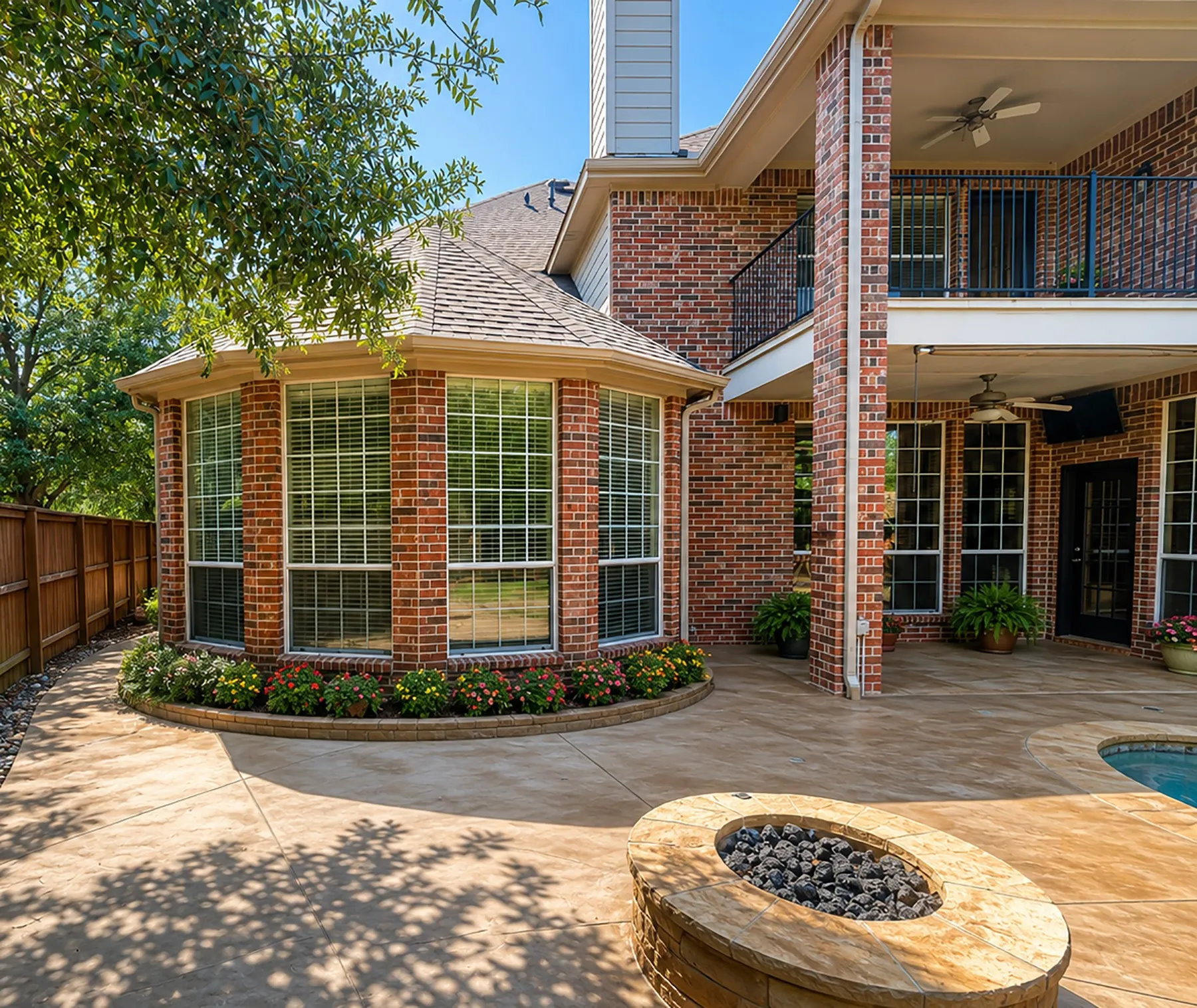 Spacious stamped concrete patio with an integrated fire pit