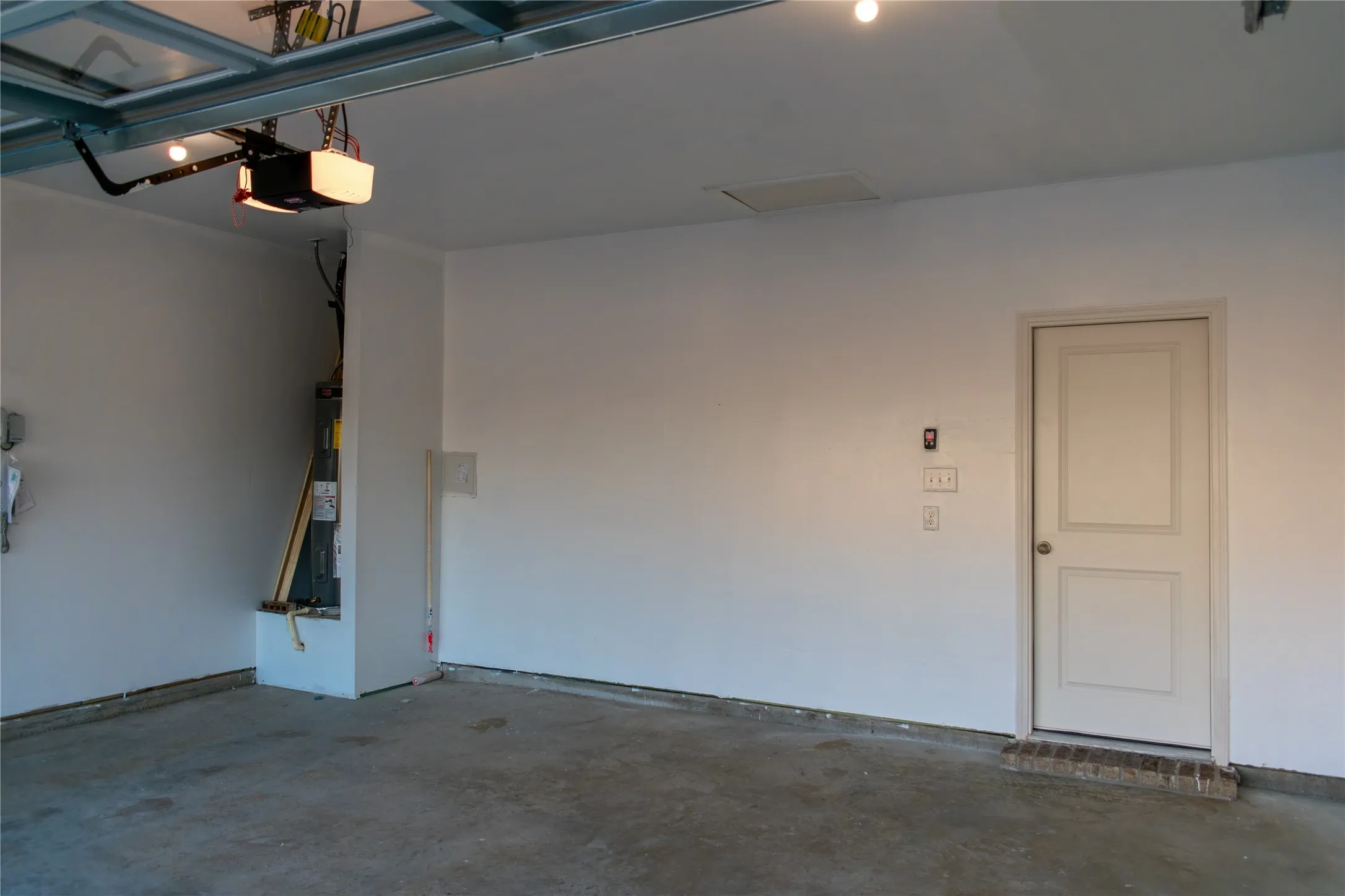 Garage featuring a garage door opener