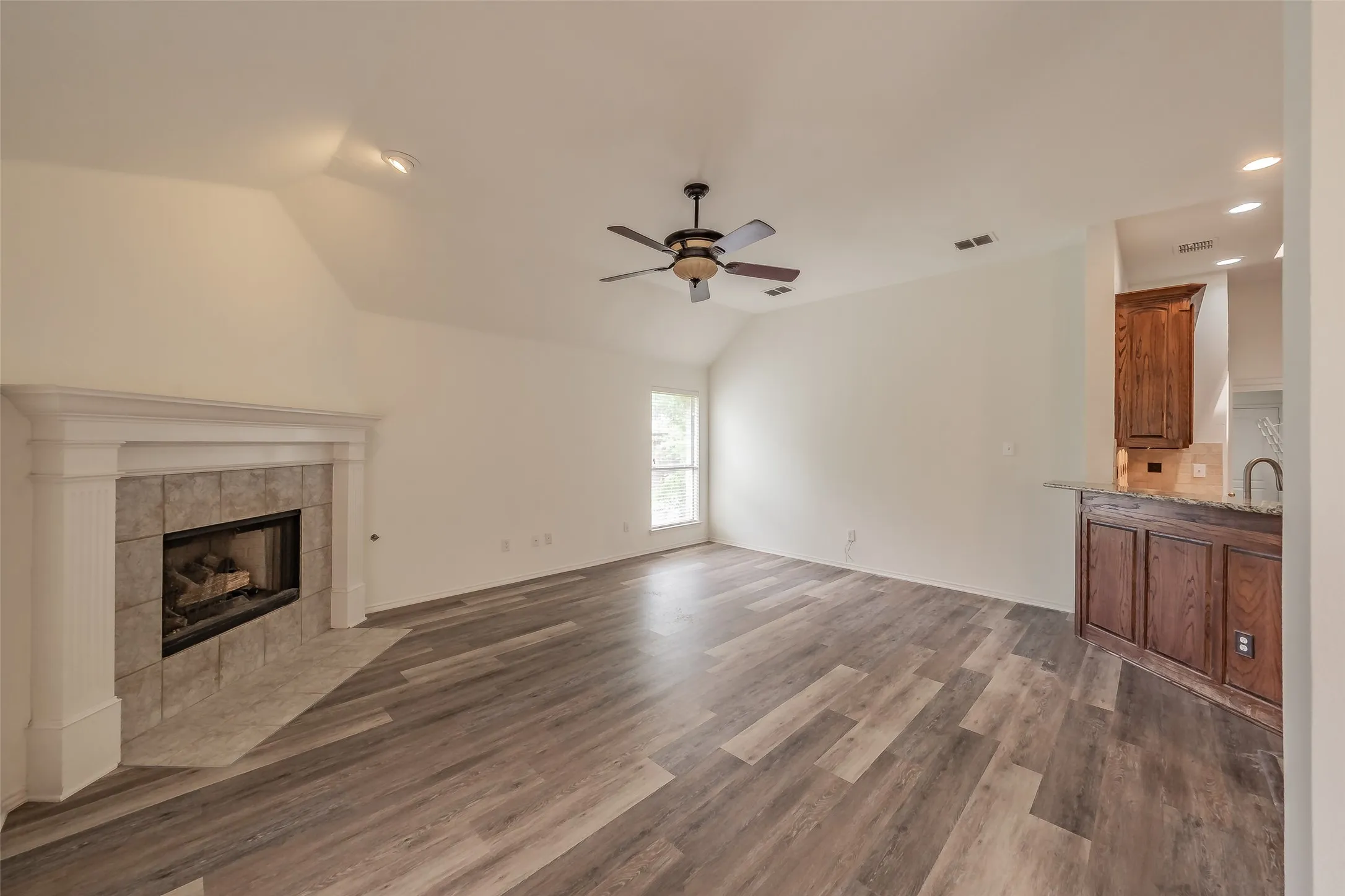 Living room off of kitchen with fireplace