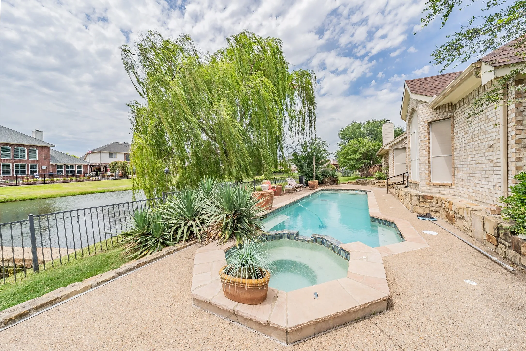 Sitting area with view of pool and canal