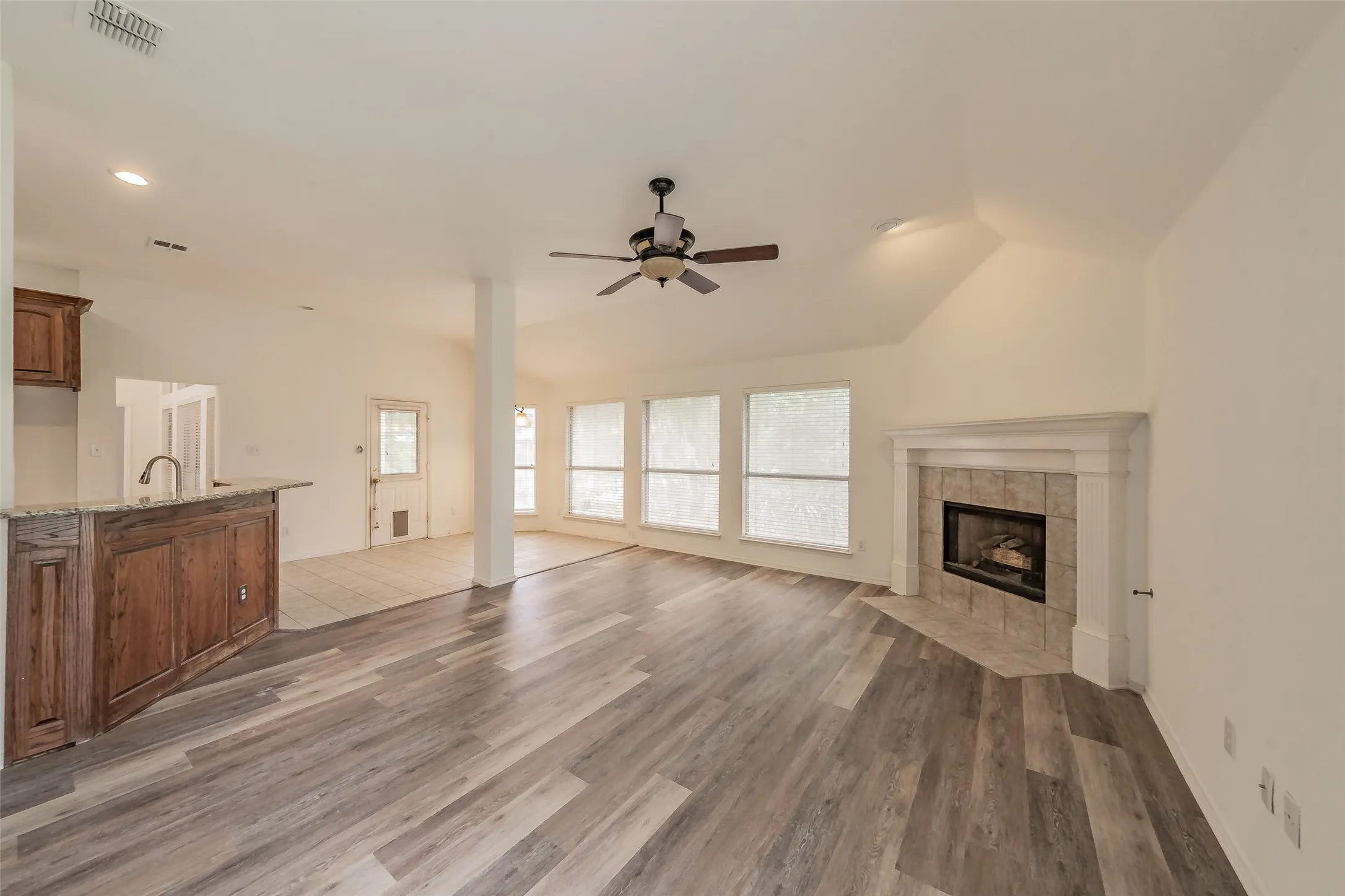 Living room off of kitchen with fireplace