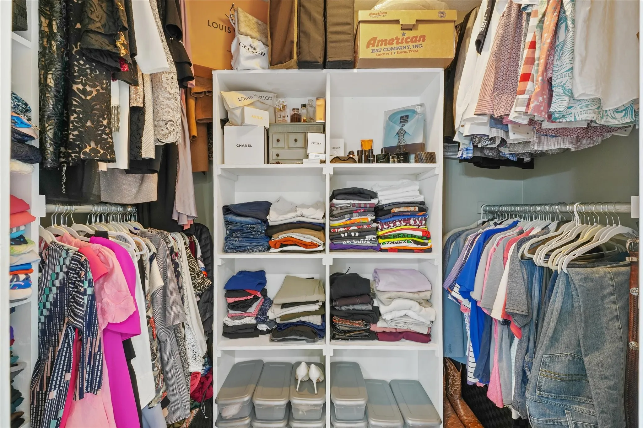 Custom closet system featuring white shelving units