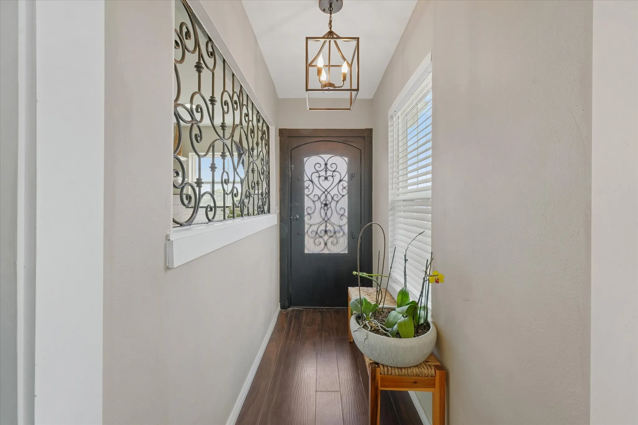 Entryway featuring wood-finish flooring and light-toned walls