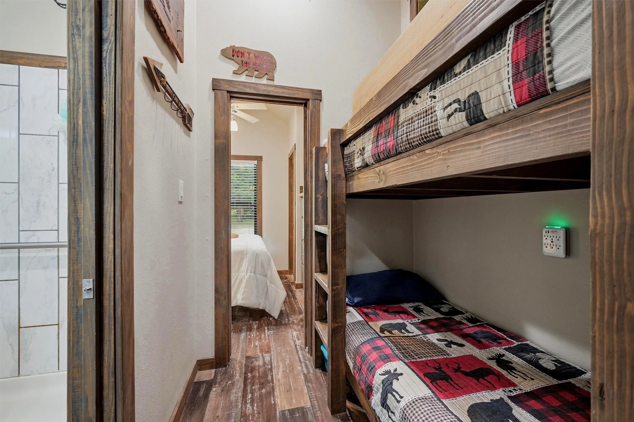 Built-in bunk beds with natural wood framing