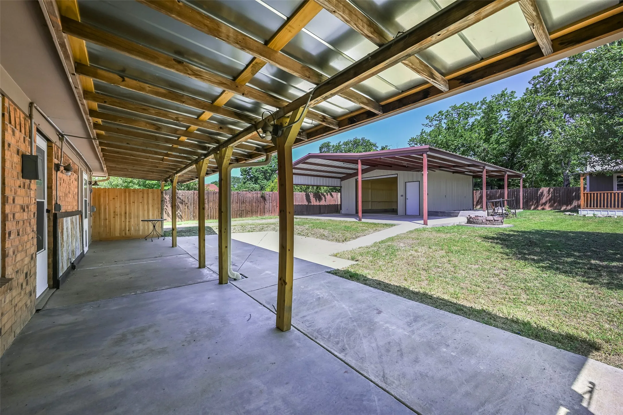 Expansive covered patio with concrete flooring