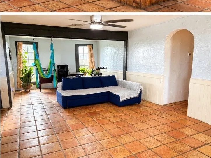 Expansive room featuring terracotta tile flooring and a ceiling fan