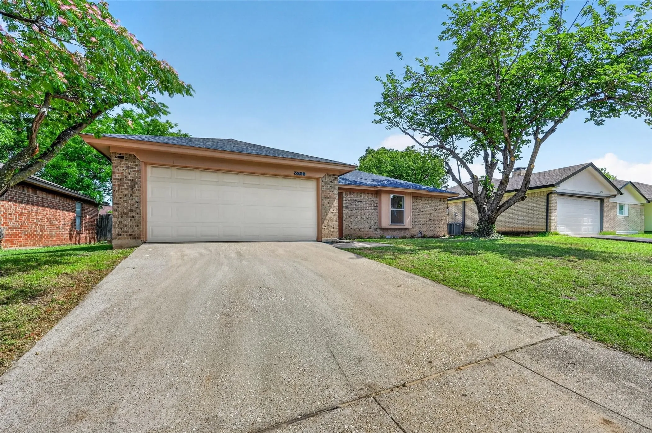 Brick exterior with a two-car garage