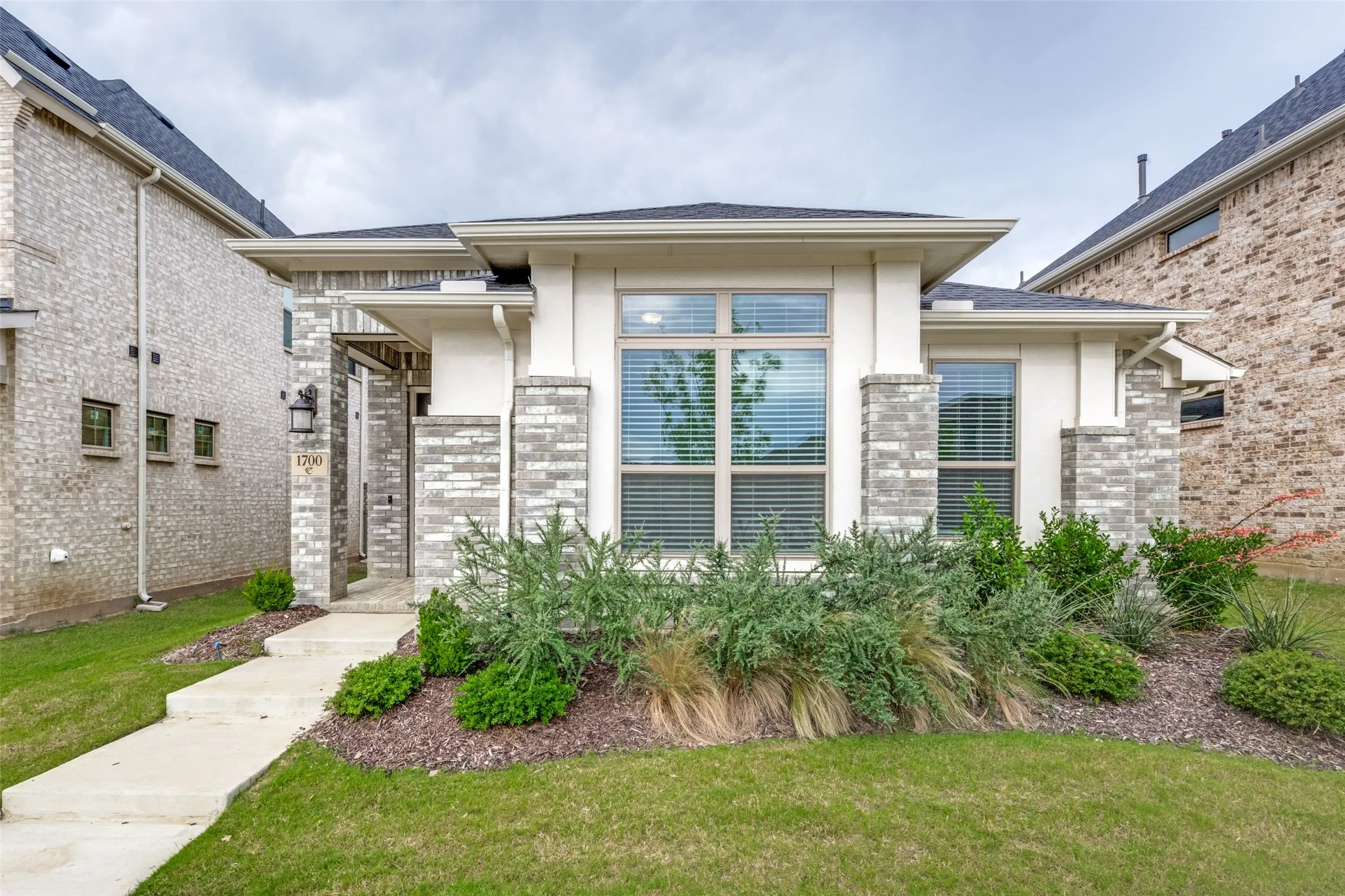 Contemporary single-story residence with a stone and stucco facade