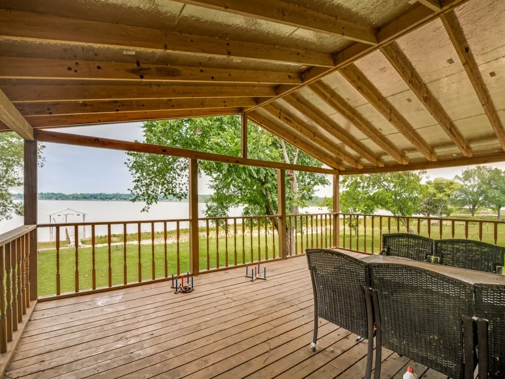 Covered Deck facing the boat dock and lake