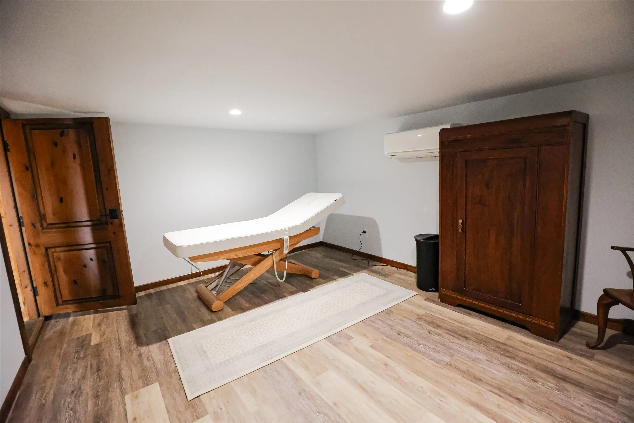 Private massage and treatment room just off the sauna, creating a true spa suite inside this Texas ranch home. It's a quiet place to recover after a day of ranch work, a hunt or a retreat session.