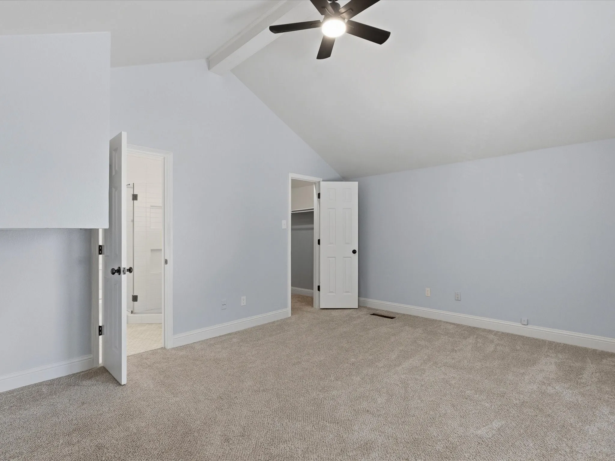 Upstairs Spacious room featuring vaulted ceilings, light-toned carpeting, and a built-in ceiling fan with integrated lighting and walk in closet and own bathroom