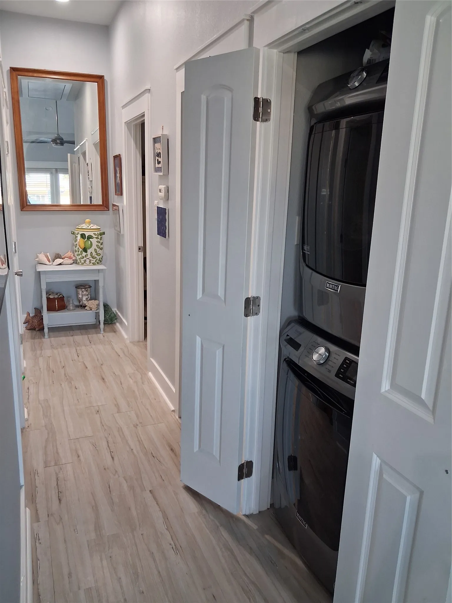 Stackable washer and dryer in hall