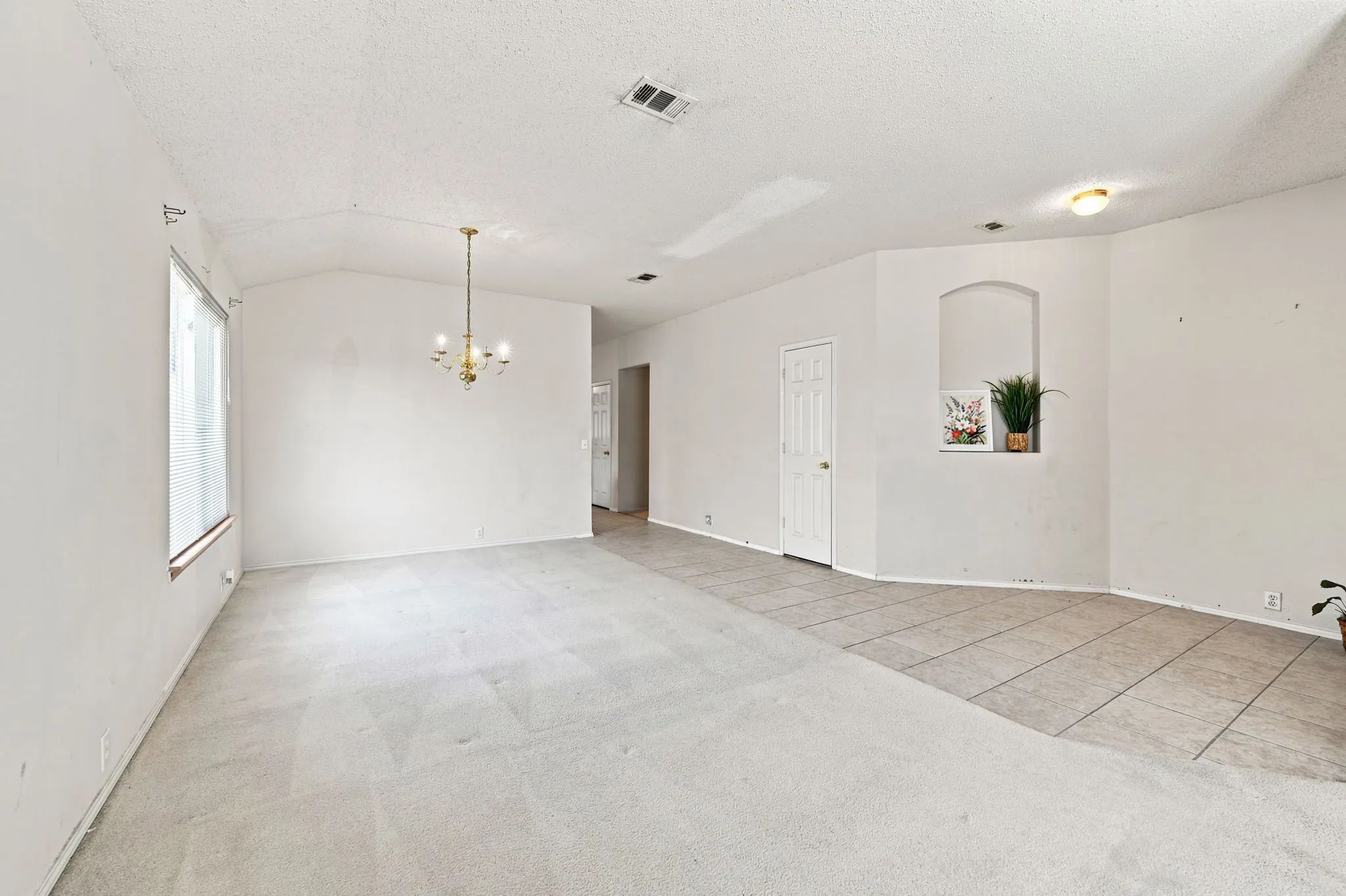 Tiled foyer with formal dining and living space.