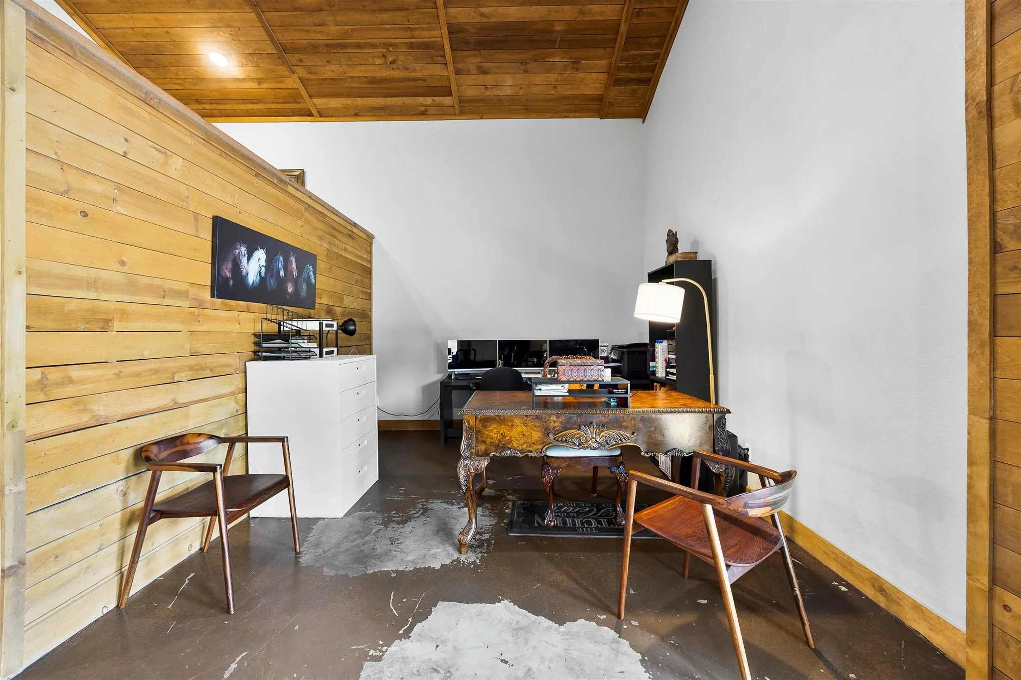 Natural wood plank wall paneling with a coordinating wood plank ceiling