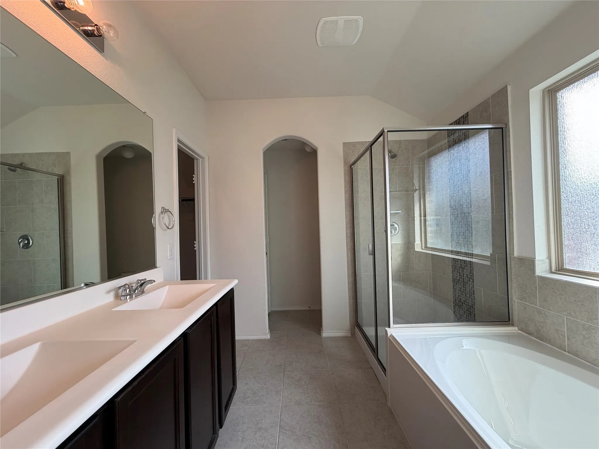 Dual vanity with garden tub and walk-in shower