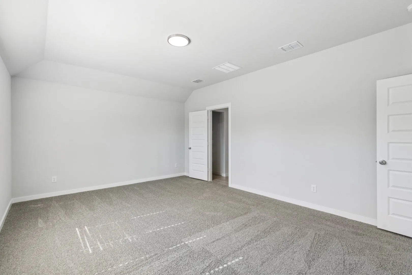Primary Suite in the Oscar home plan by Trophy Signature Homes – REPRESENTATIVE PHOTO