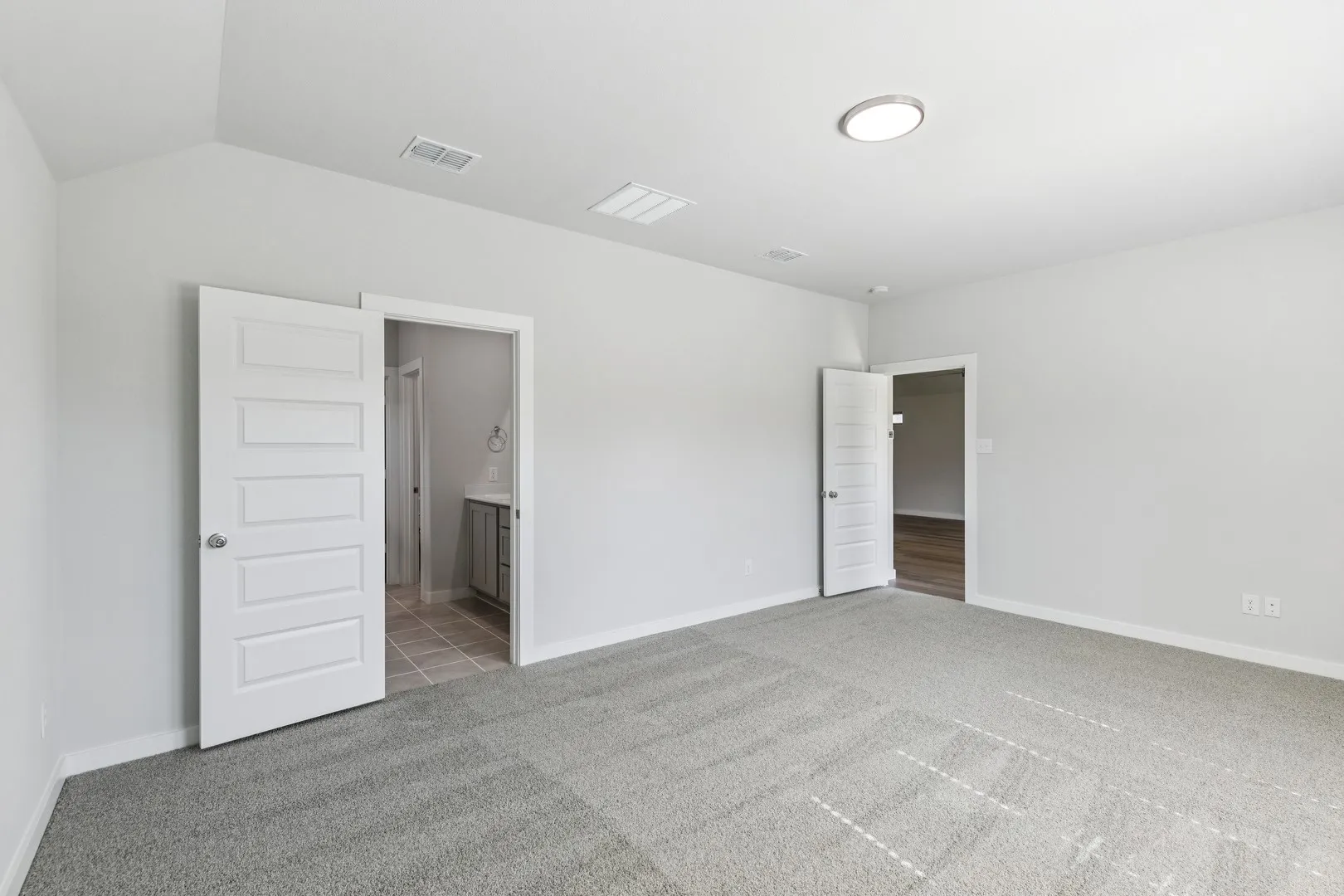 Primary Suite in the Oscar home plan by Trophy Signature Homes – REPRESENTATIVE PHOTO