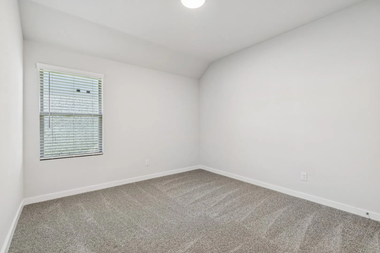 Bedroom in the Oscar home plan by Trophy Signature Homes – REPRESENTATIVE PHOTO