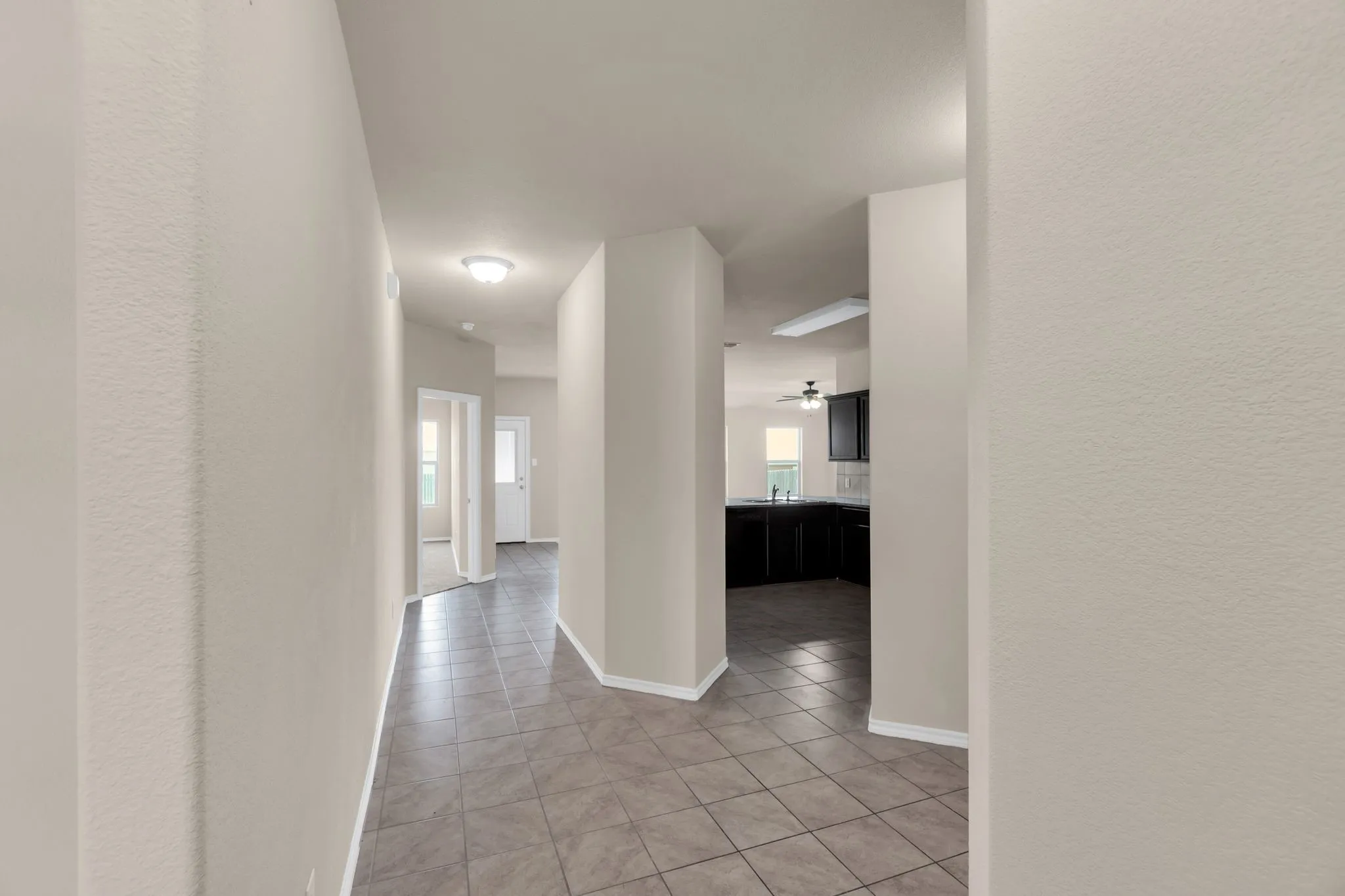 Hall with light tile floors