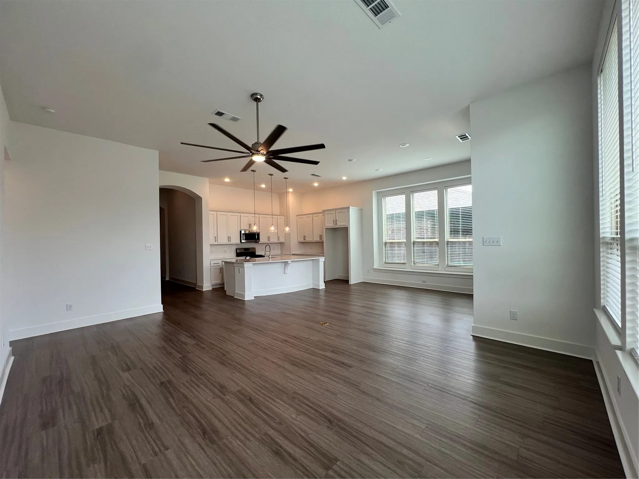 Large living area open to kitchen and dining room.