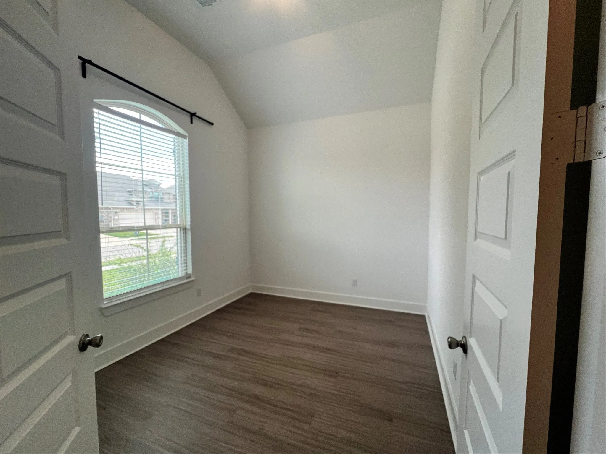 Double doors lead to study of the entry.