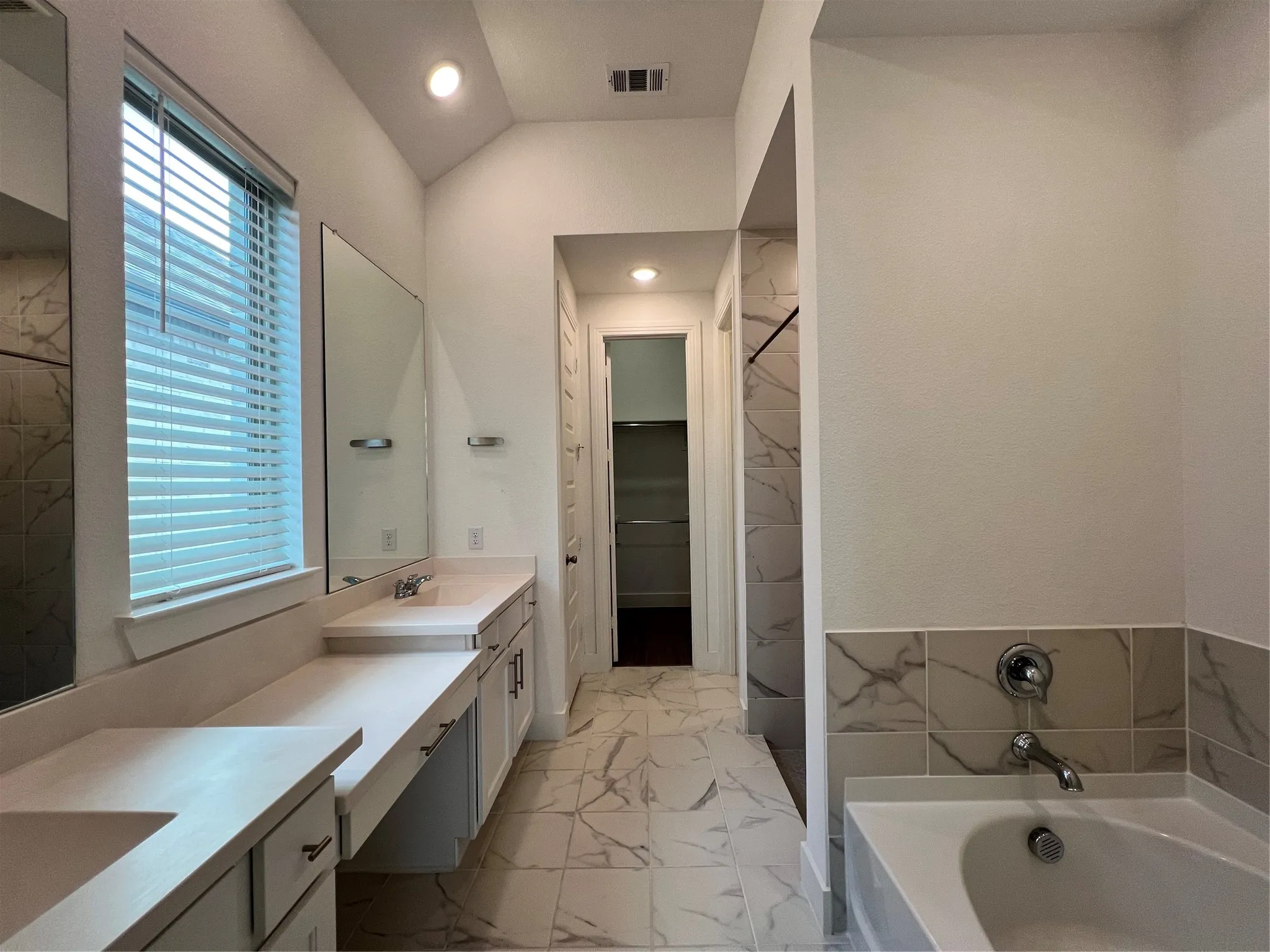 Primary bath with soaking tub, separate shower and huge walk-in closet.