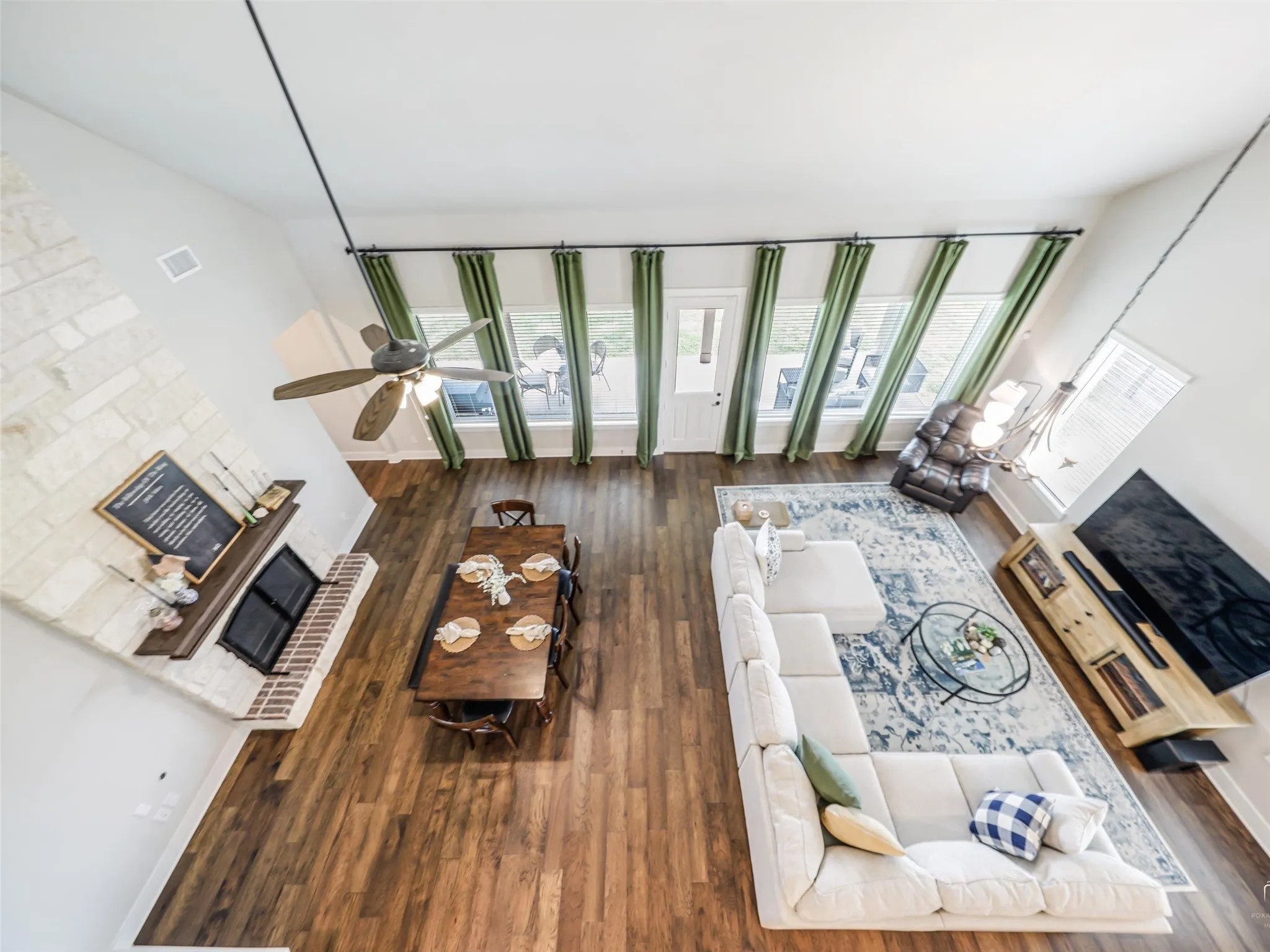 Breathtaking view of the soaring two-story ceilings and open upper-level landing at this 4-bedroom, 3.5-bath Van Alstyne estate on 1 acre.