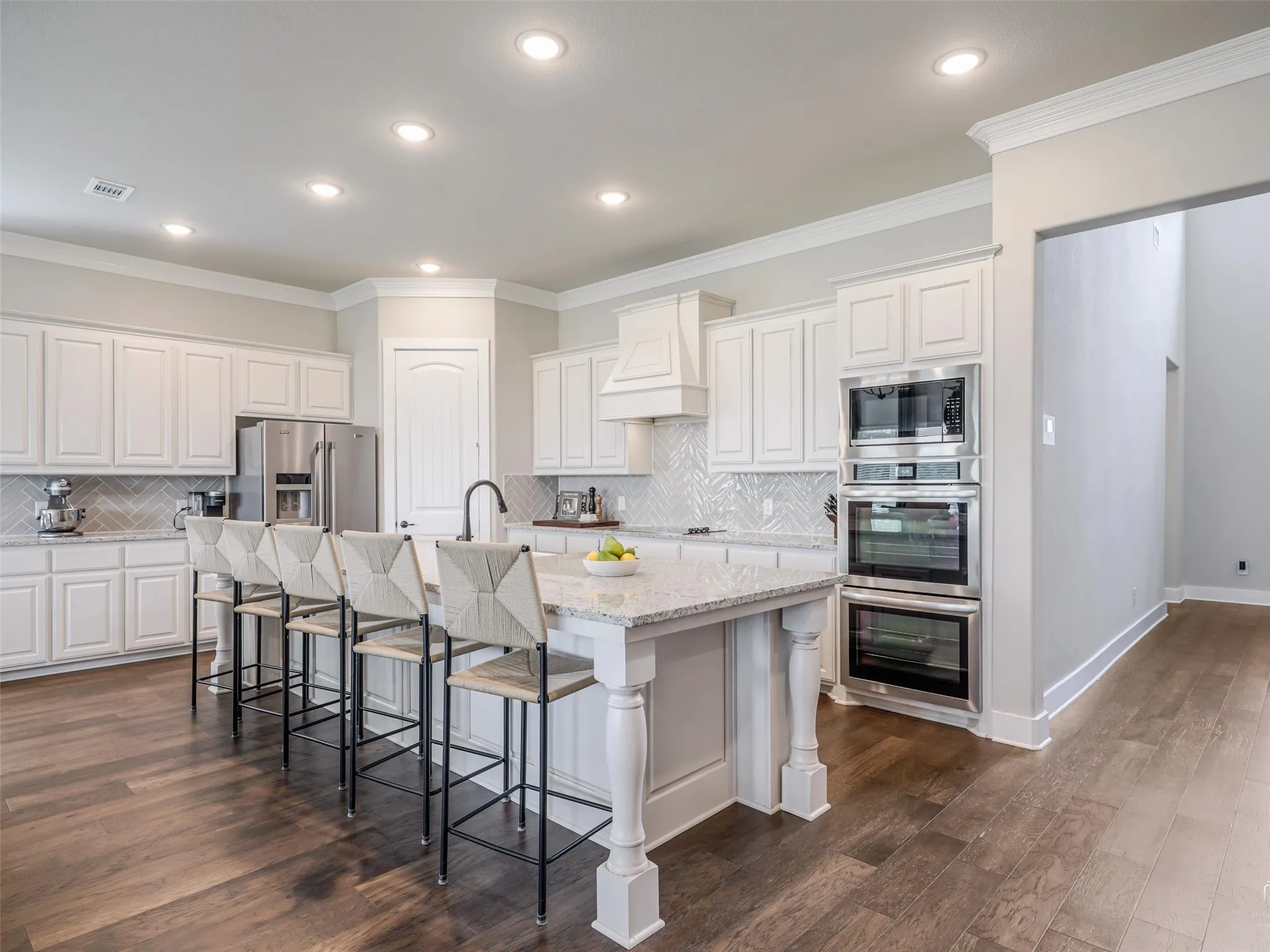 Massive 12-foot quartz island with ample seating at 544 Majors Road, perfect for casual dining and entertaining in this 4-bedroom Van Alstyne home on 1 acre.