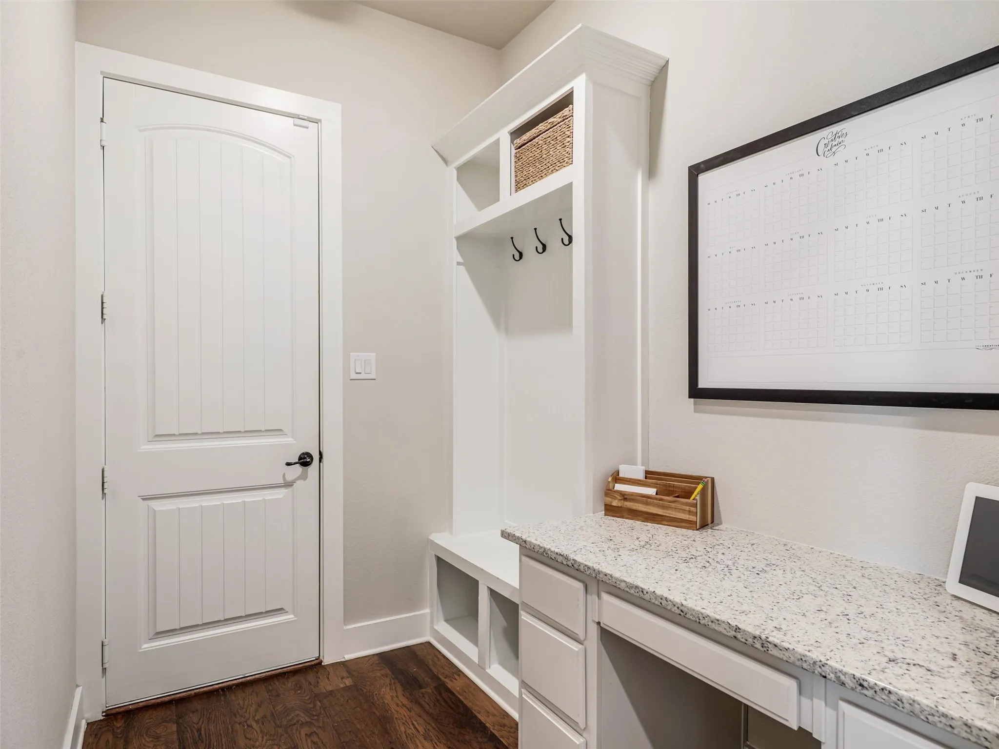Convenient mud room at 544 Majors Road featuring a built-in desk and organizational drop zone, located just off the 3.5-car garage in this 4-bedroom Van Alstyne home with full spray foam insulation.
