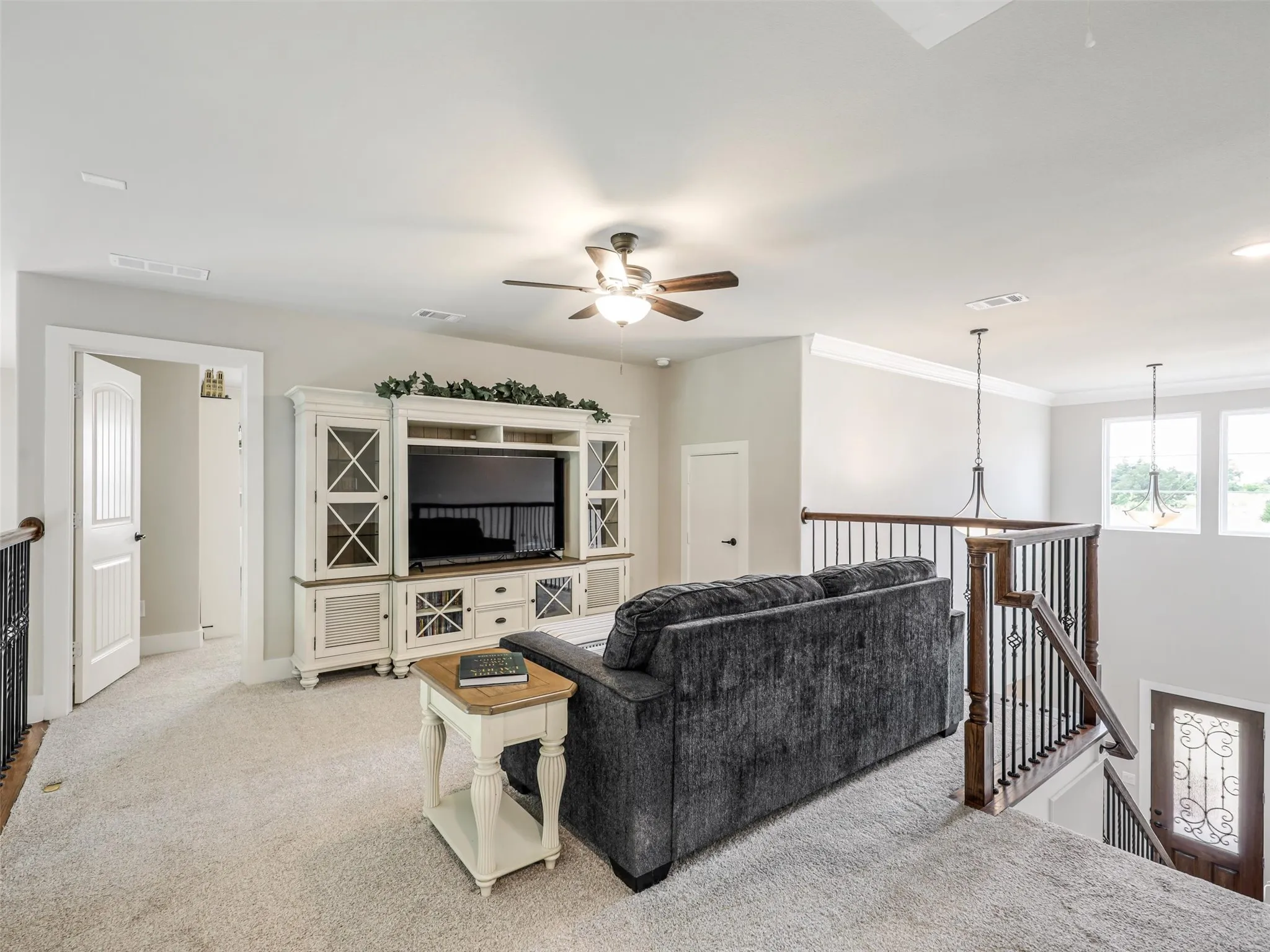 Versatile upstairs loft at 544 Majors Road overlooking the two-story living area, ideal for a media room or playroom in this Van Alstyne estate on 1 acre.