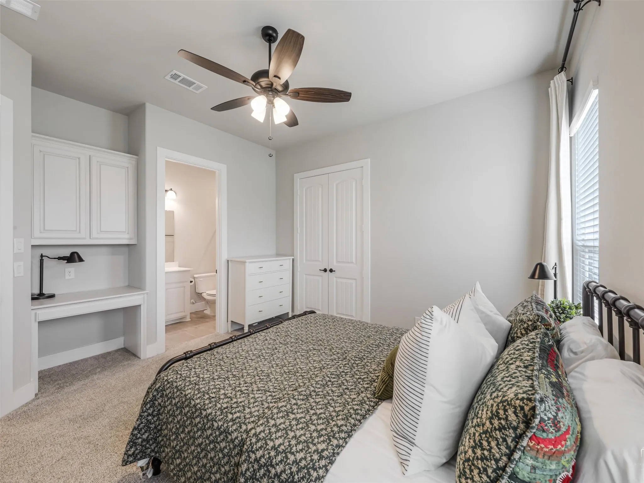 Comfortable main-floor guest bedroom at 544 Majors Road with wood floors, generous closet space, and easy access to a full bathroom in Van Alstyne, Texas.