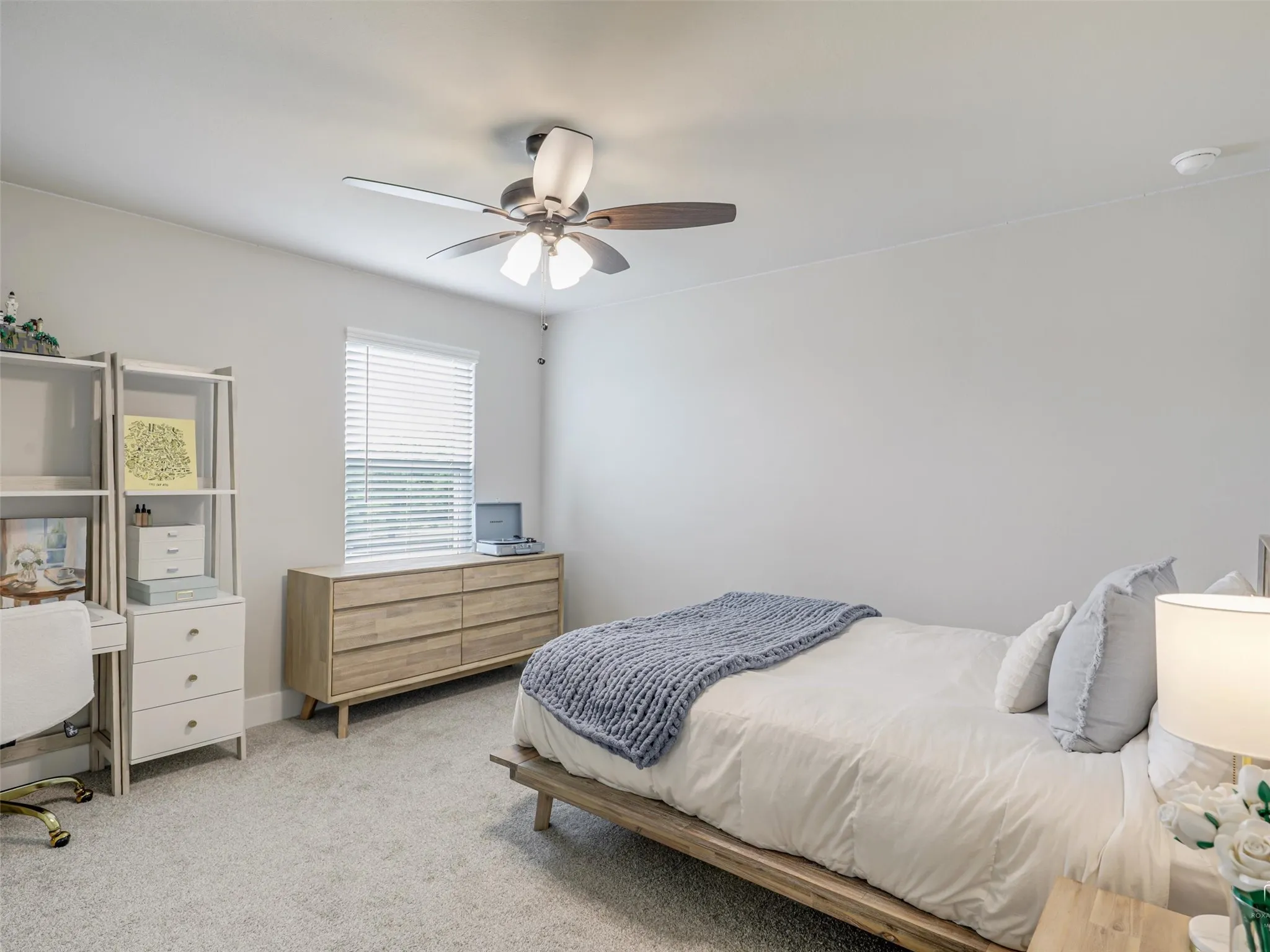 Bright upstairs bedroom at 544 Majors Road with large windows, generous closet space, and access to a full bathroom in this Van Alstyne, Texas estate.