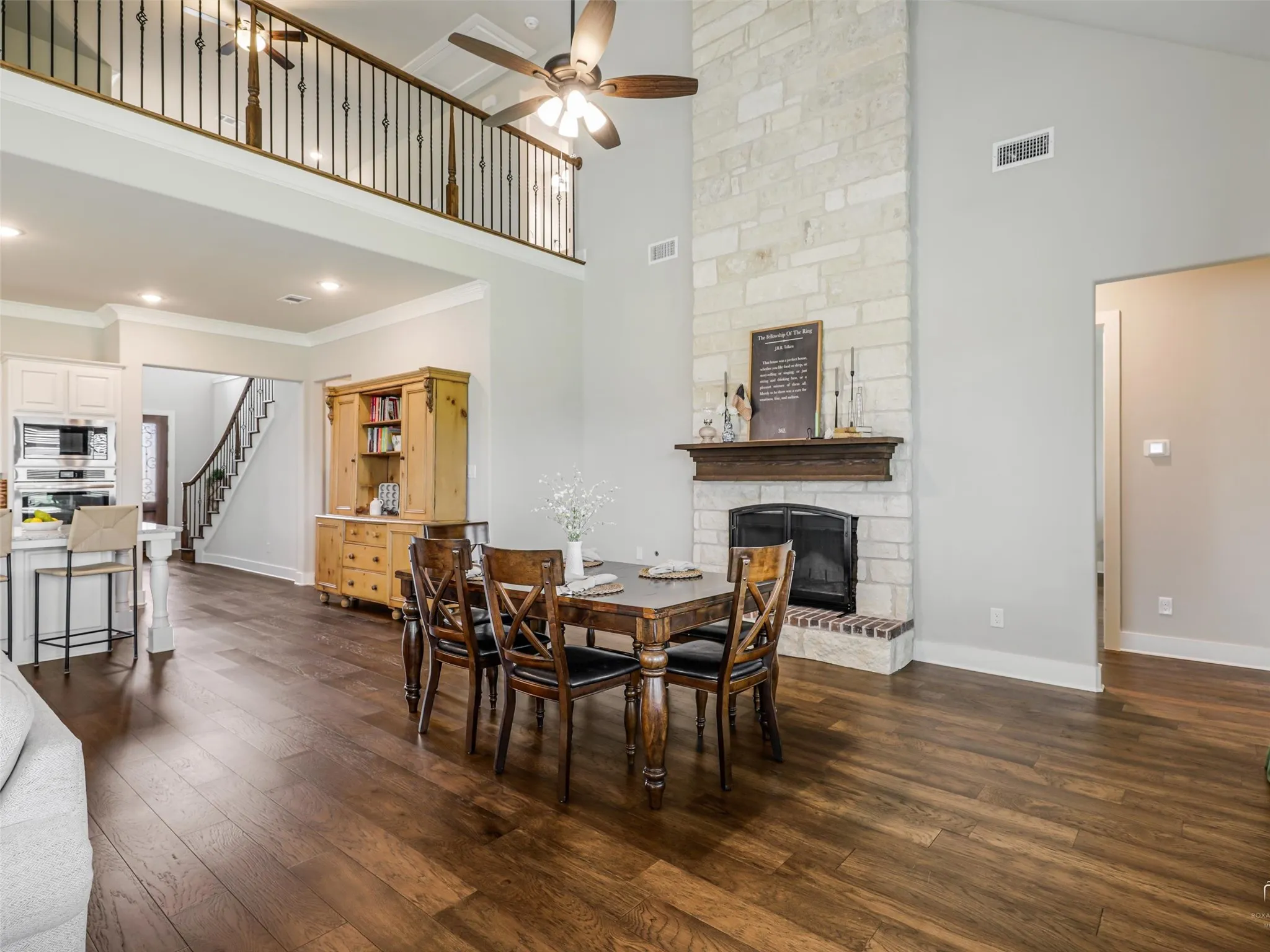 Inviting living space anchored by a statement fireplace at 544 Majors Road, perfect for cozy evenings in this 4-bedroom, 3.5-bath Van Alstyne home on a 1-acre pipe-fenced lot.