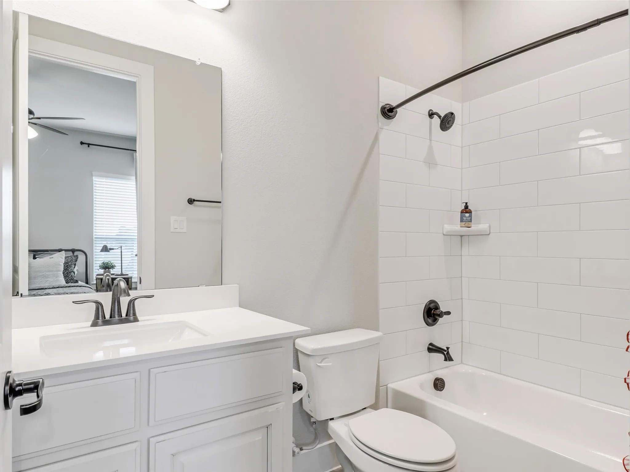 Well-appointed upstairs full bathroom at 544 Majors Road serving both secondary bedrooms and the flexible loft in this Van Alstyne estate with spray foam insulation.