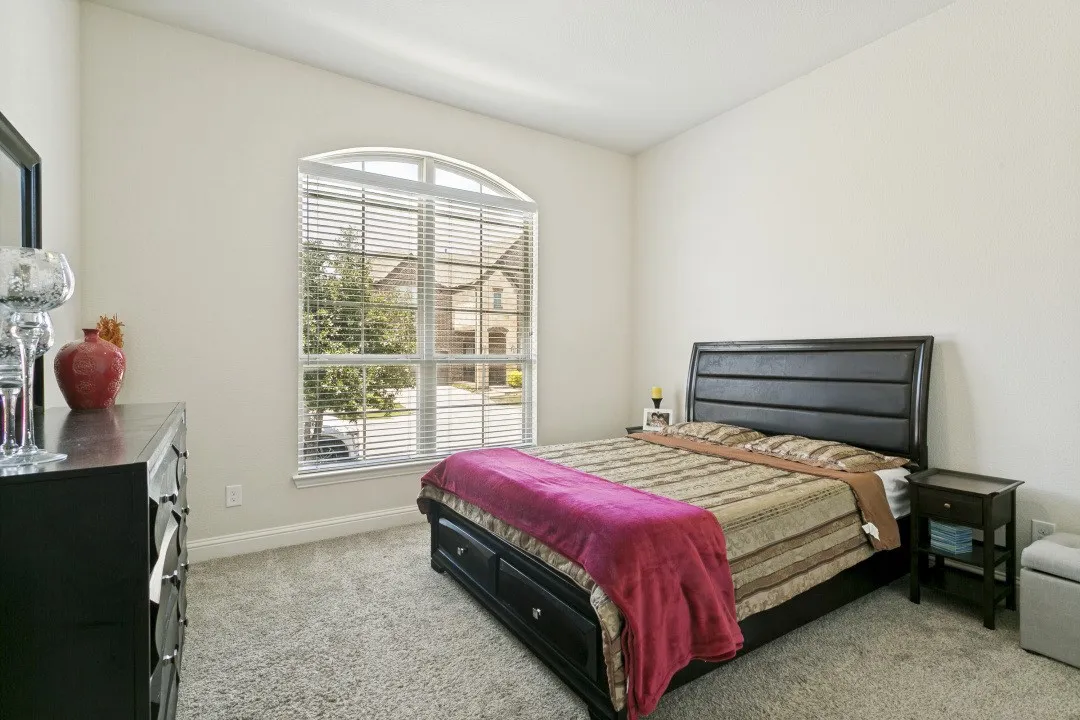 Downstairs bedroom with full private bath and closet.