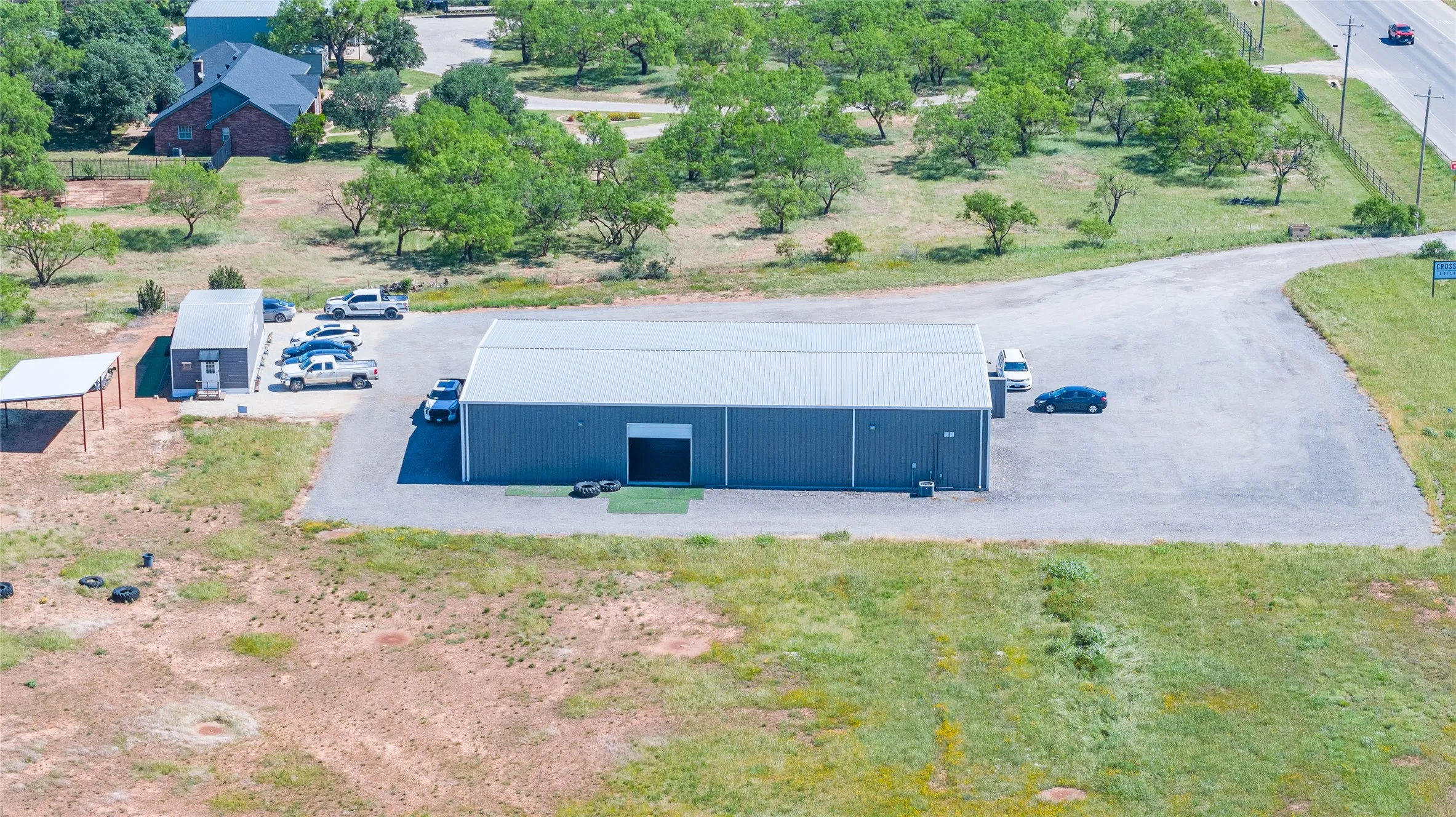 Industrial metal building featuring a gray exterior and light gray roof