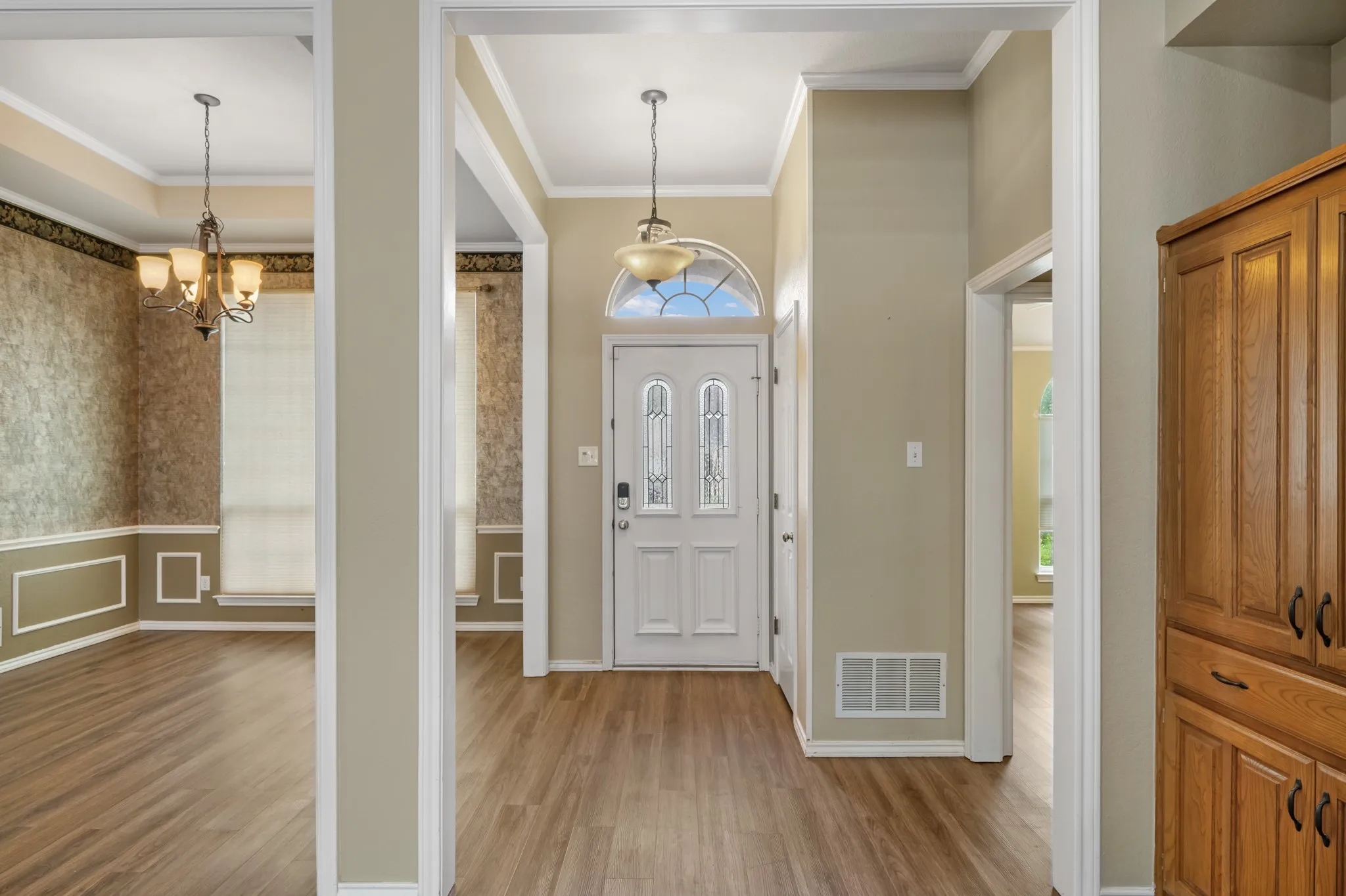 Pretty entry way with leaded glass door and fan-shaped window