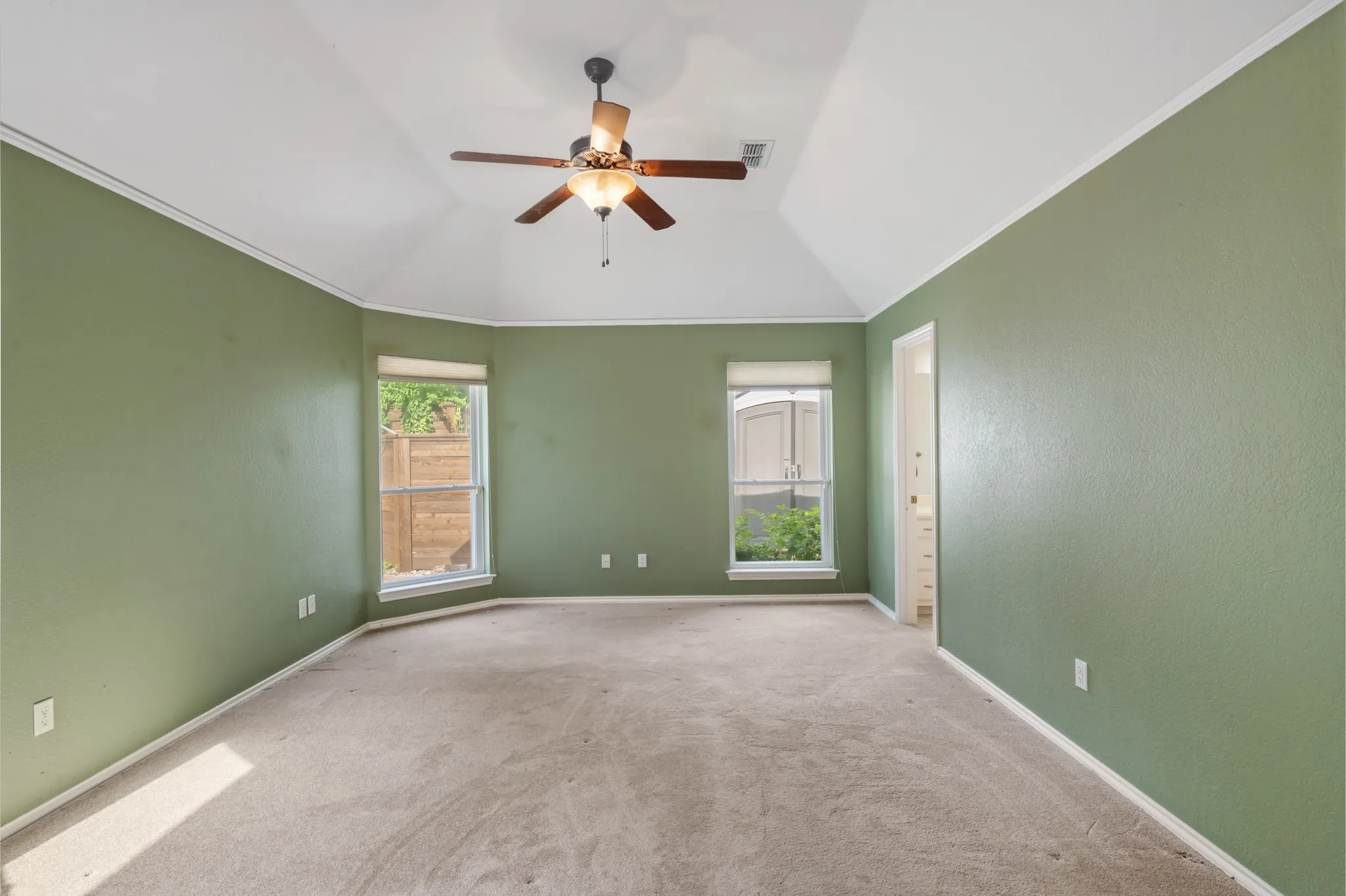 Split primary bedroom with seating area