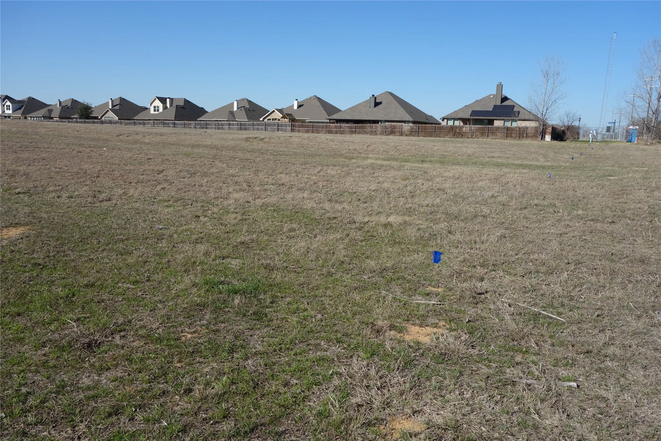 Expansive undeveloped lot featuring a flat topography and visible property markers