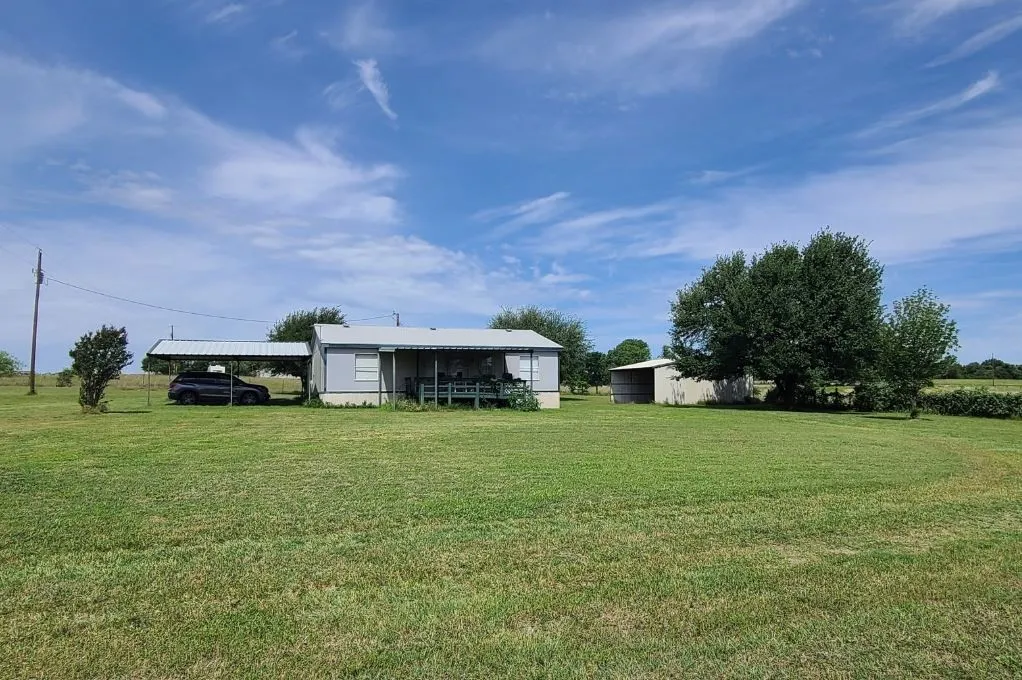 Front of House and Outbuilding