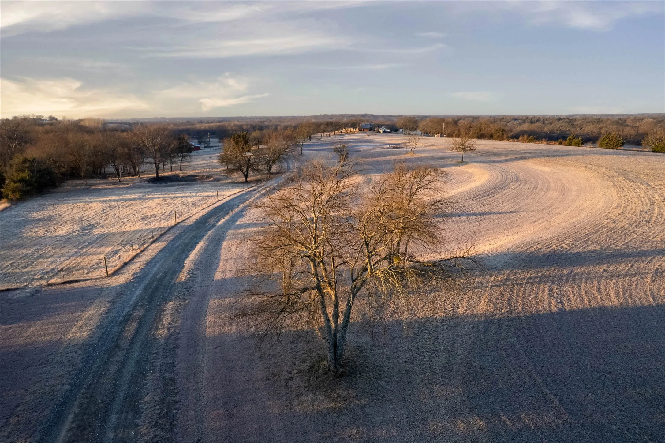 Expansive acreage featuring a private road, mature trees, and varied terrain