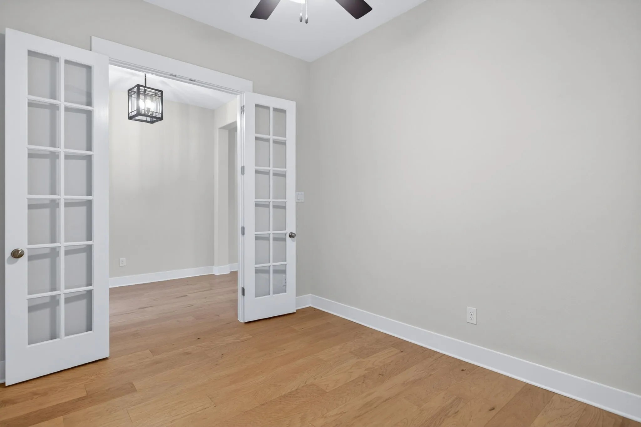 Room featuring light wood-finish flooring and neutral wall tones
