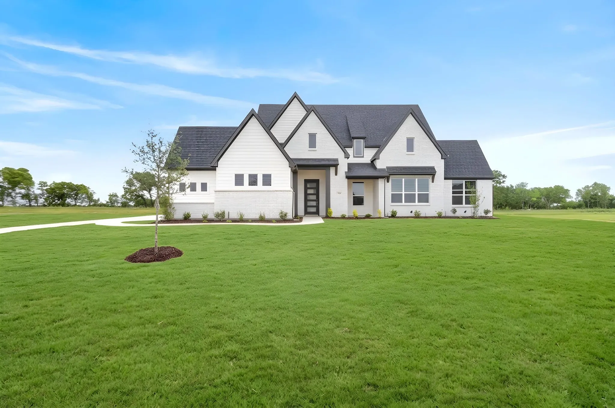 Contemporary exterior with white brick and dark trim accents