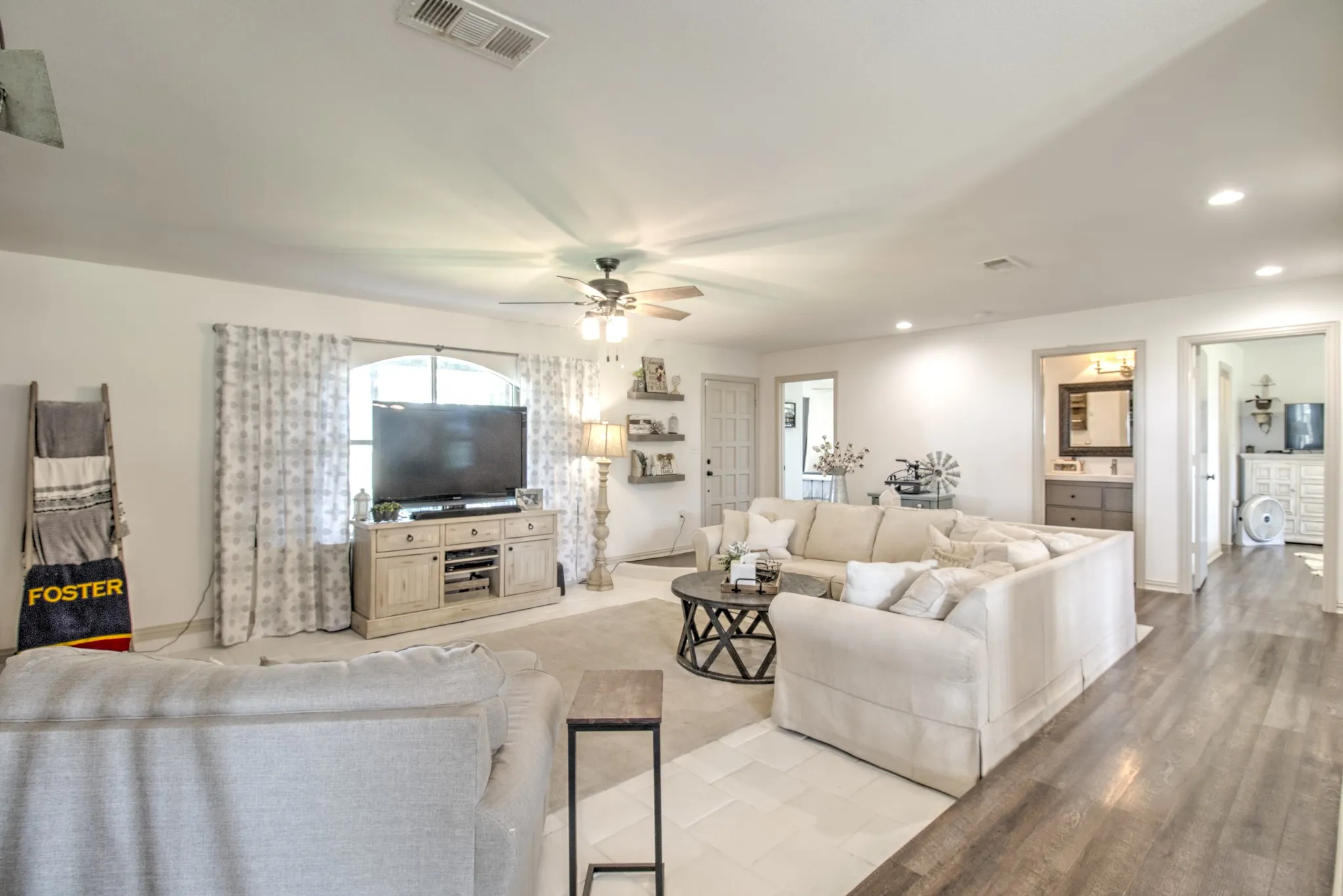 View showcases a bright, spacious living room featuring a clean, neutral color palette!