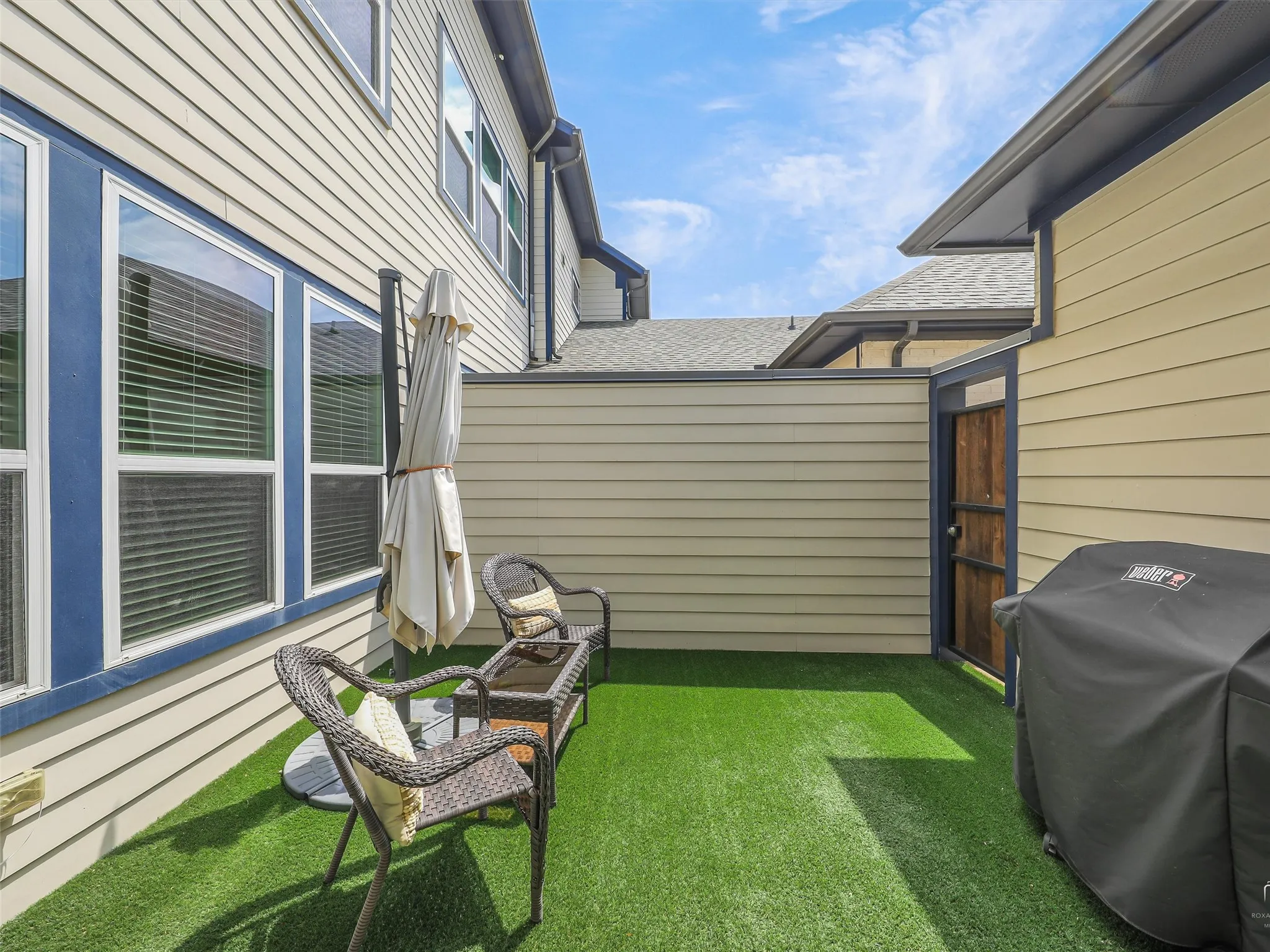 Large Patio with Turf cover and plumbed for gas grill